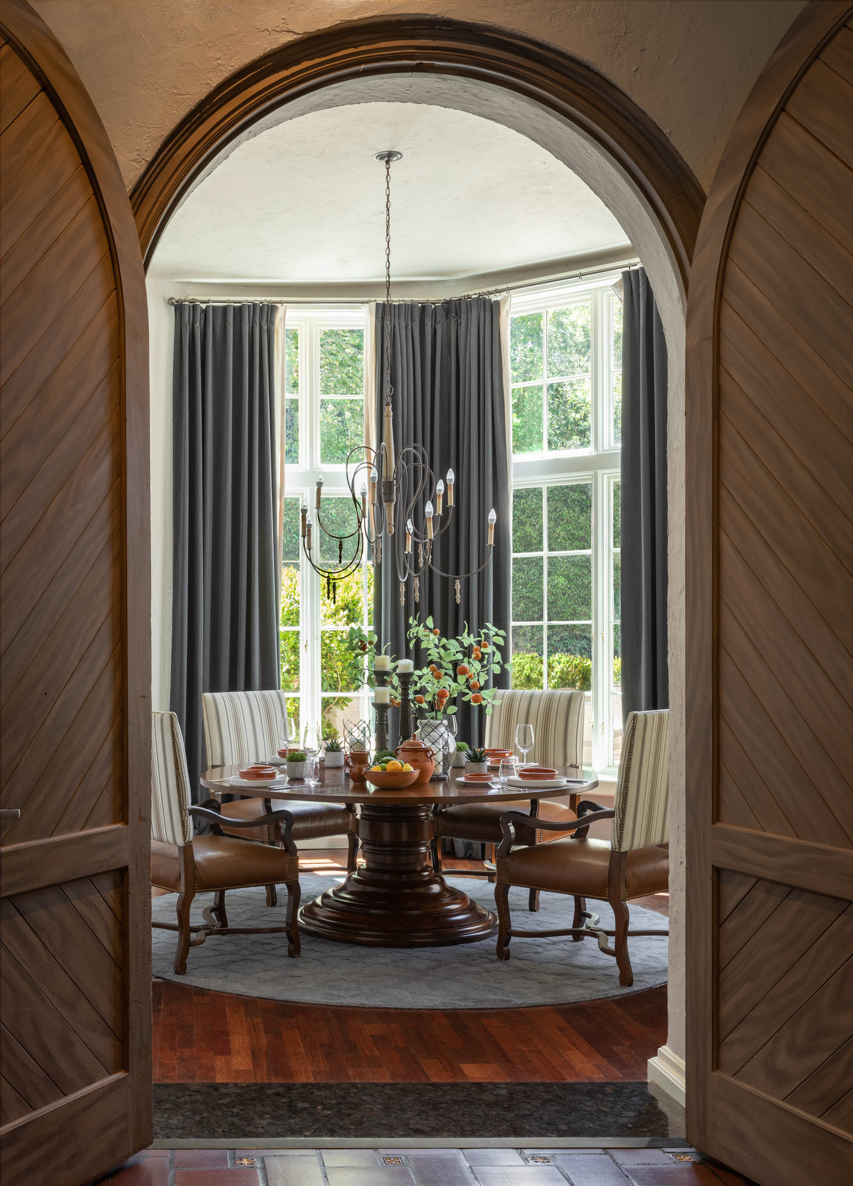 a dining room with a chandelier and a table