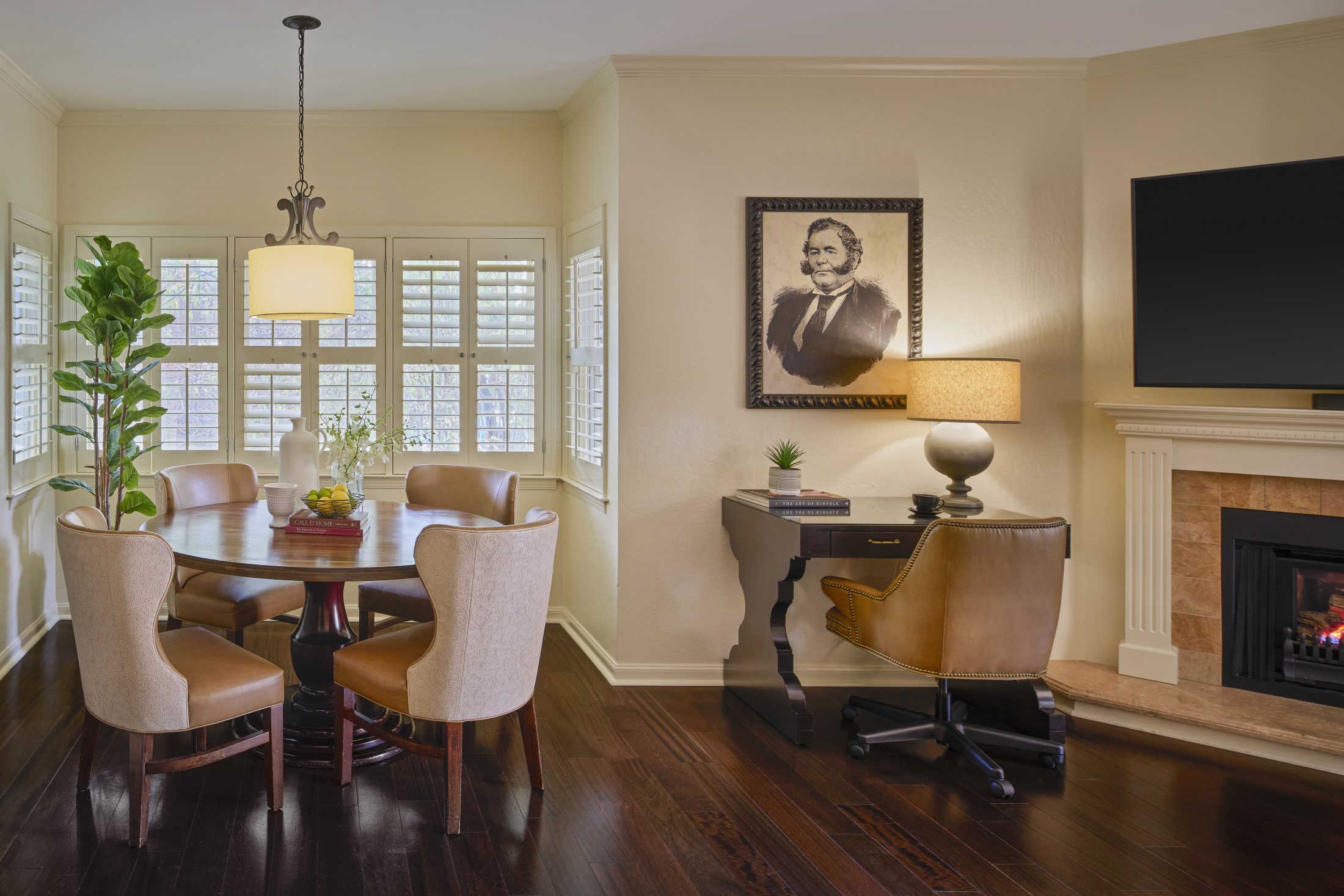 a dining room with a table and chairs