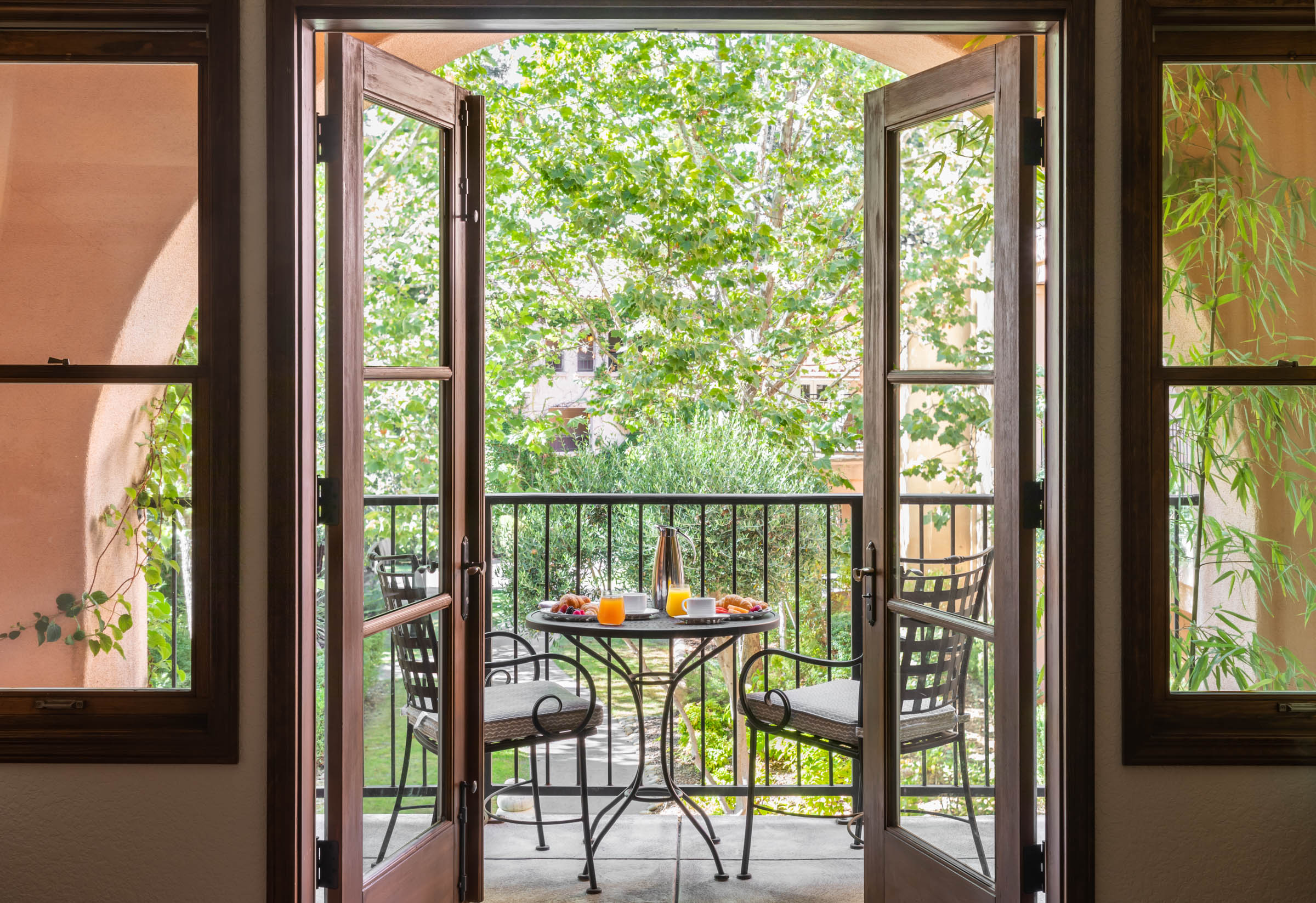 a table and chairs on a balcony
