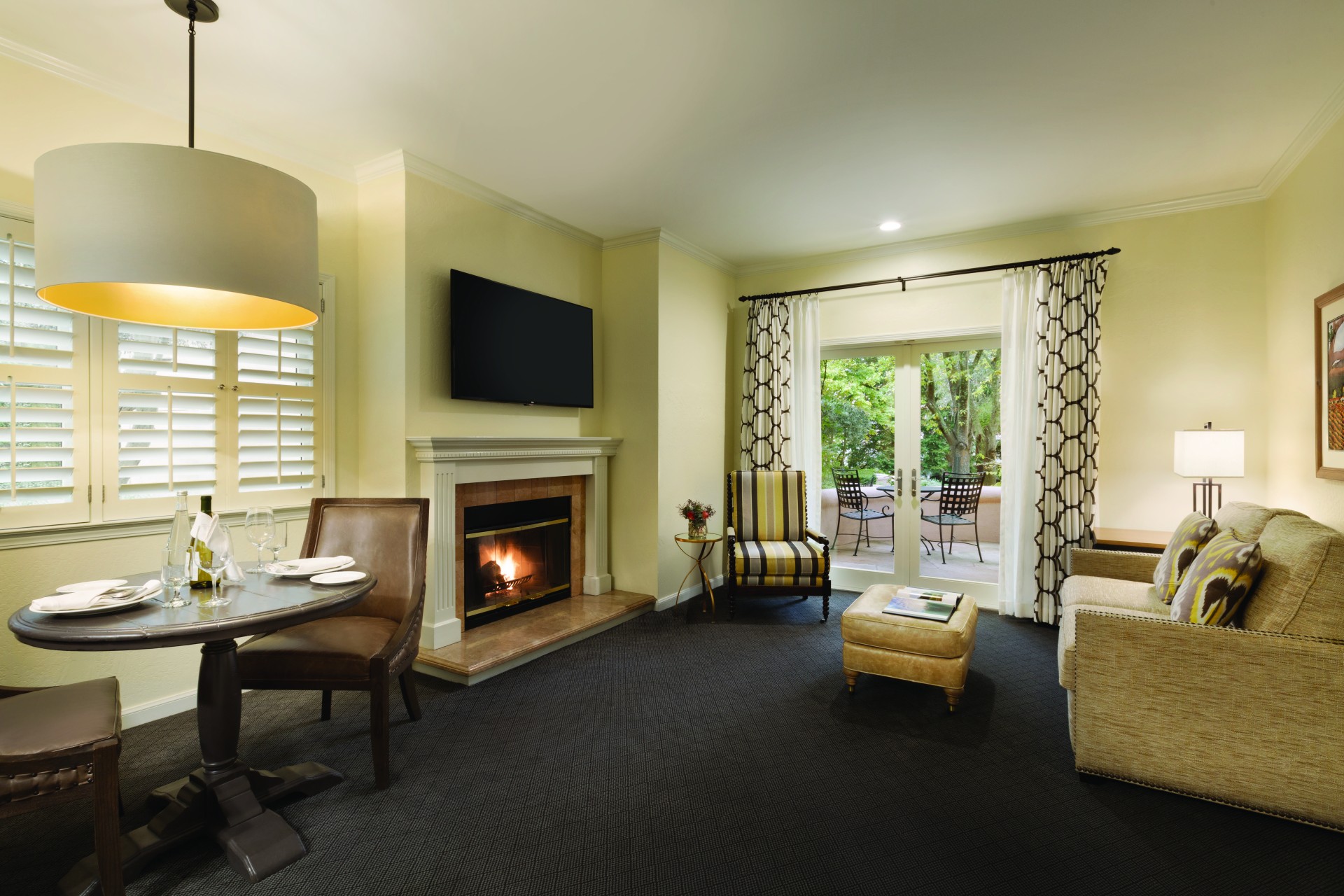 a room with a fireplace and a table