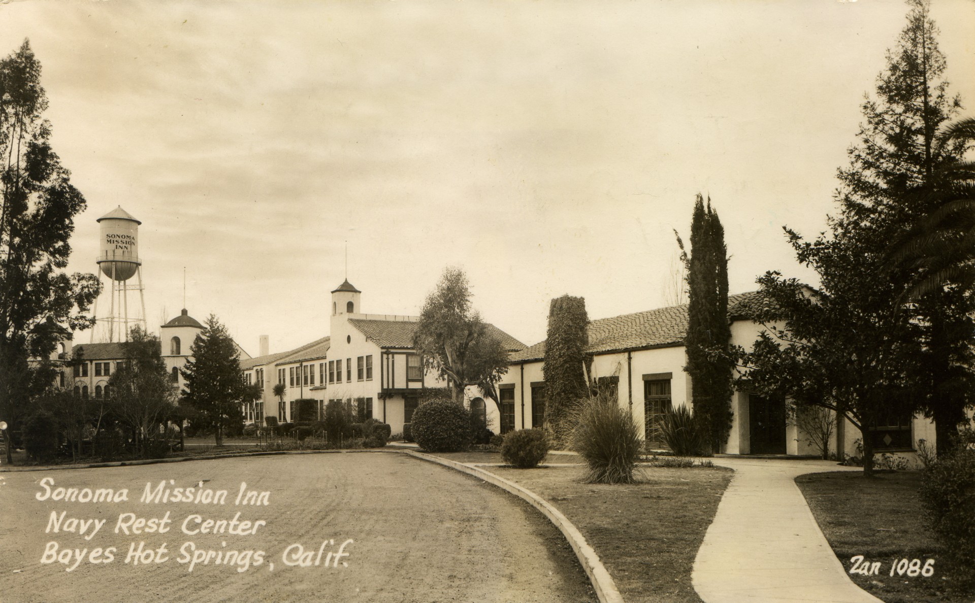 a building with a tower and a road