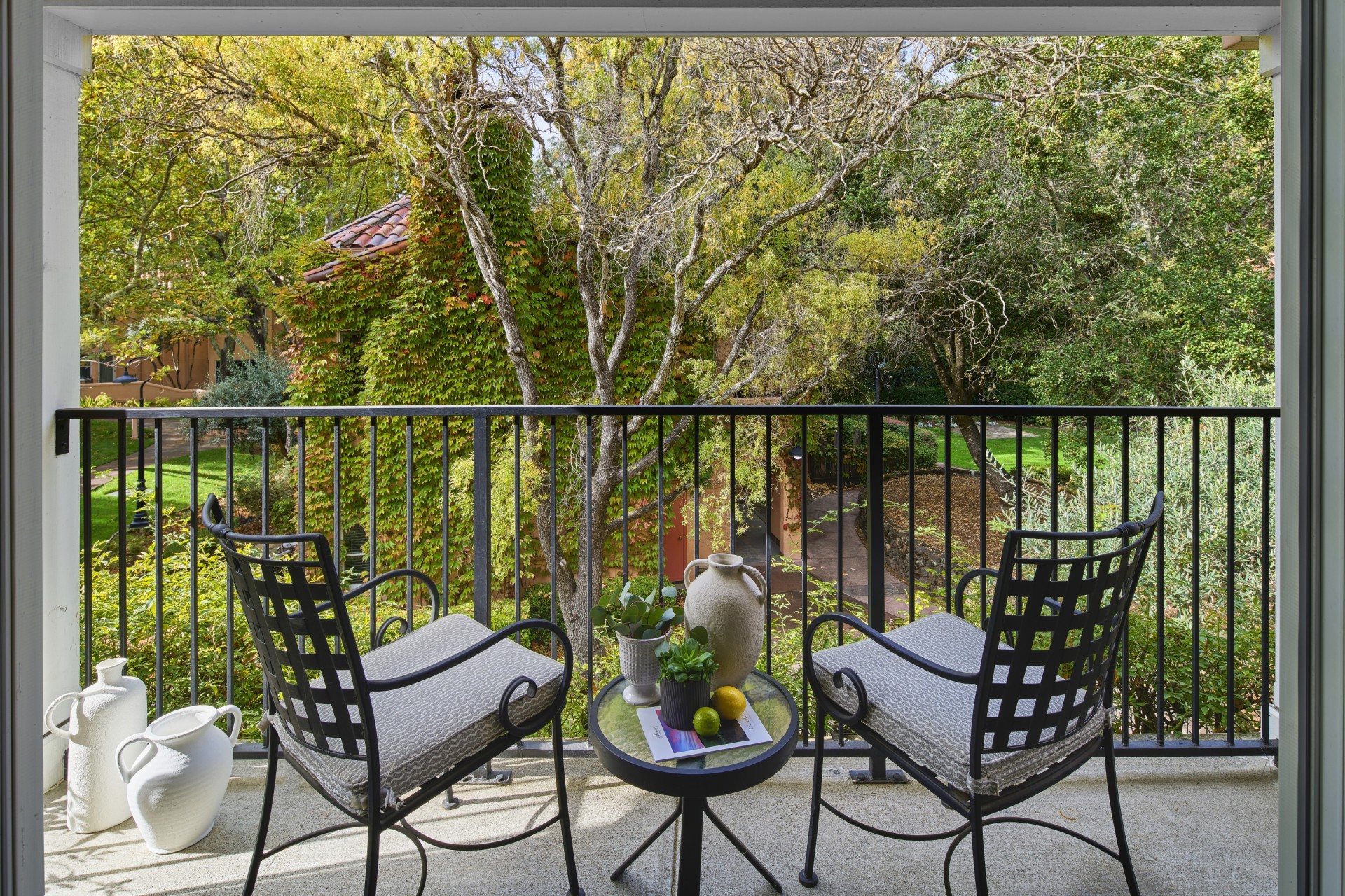 a patio with chairs and a table