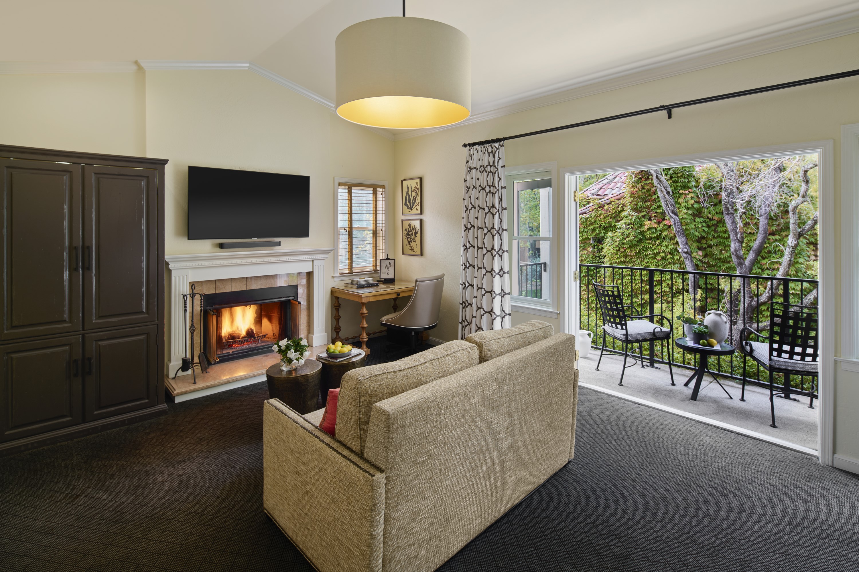 a living room with a fireplace and a television