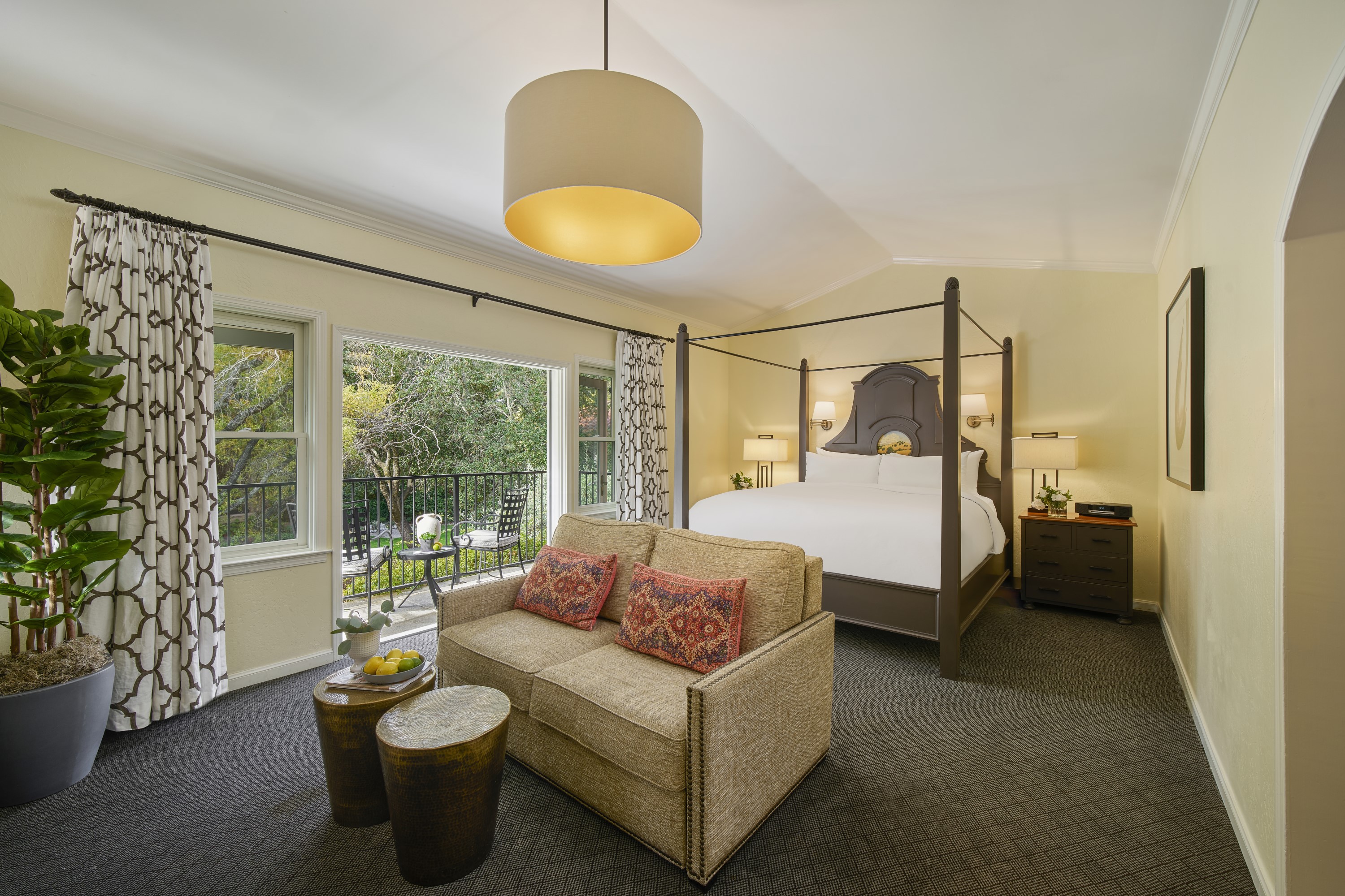 a bedroom with a bed and a couch