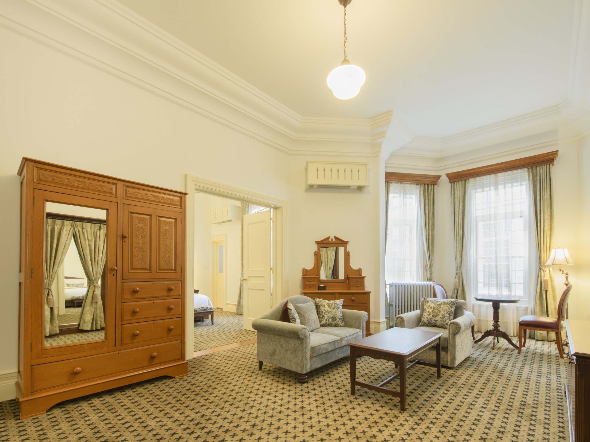 a room with a couch and a dresser
