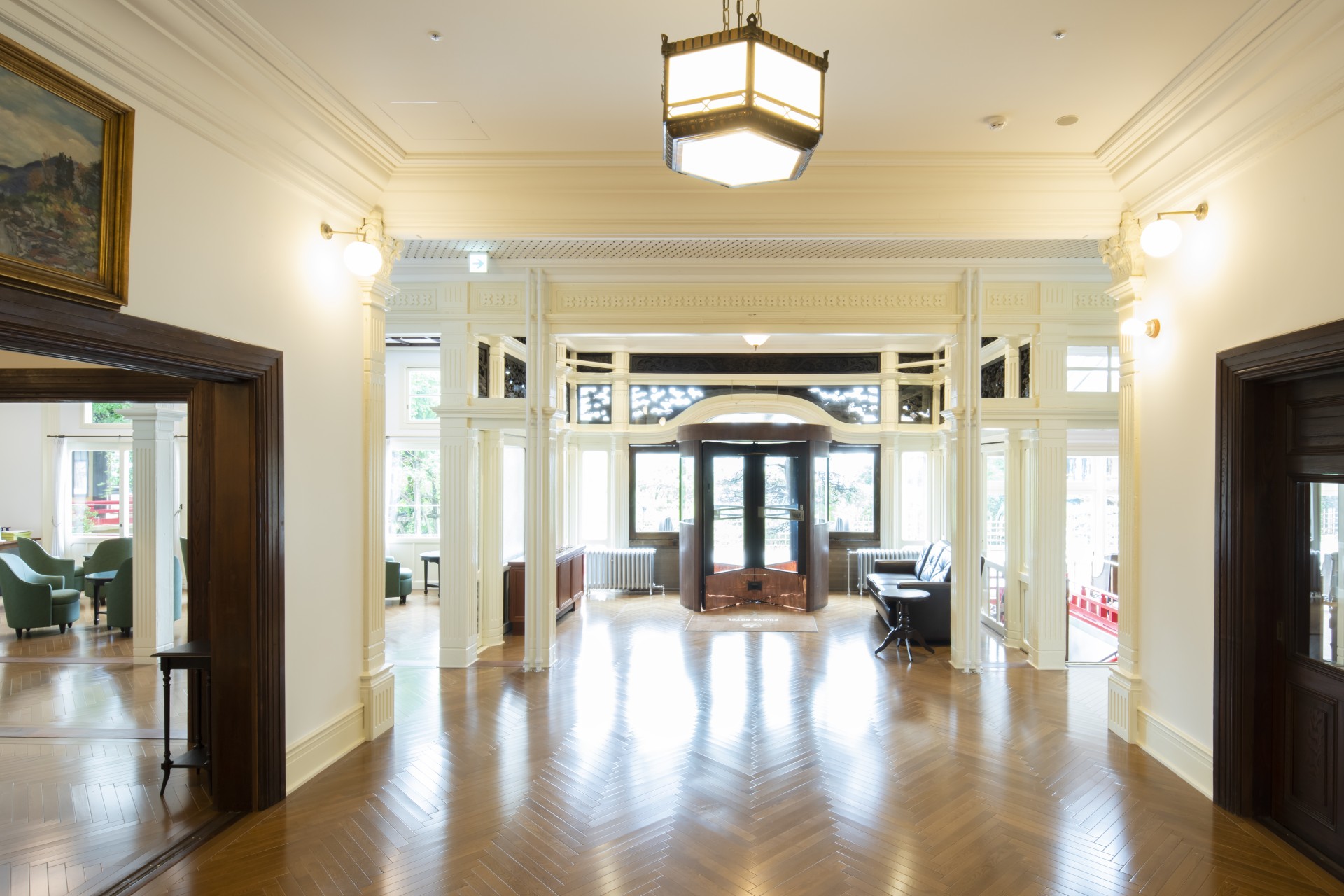 a large room with a wood floor and a light fixture