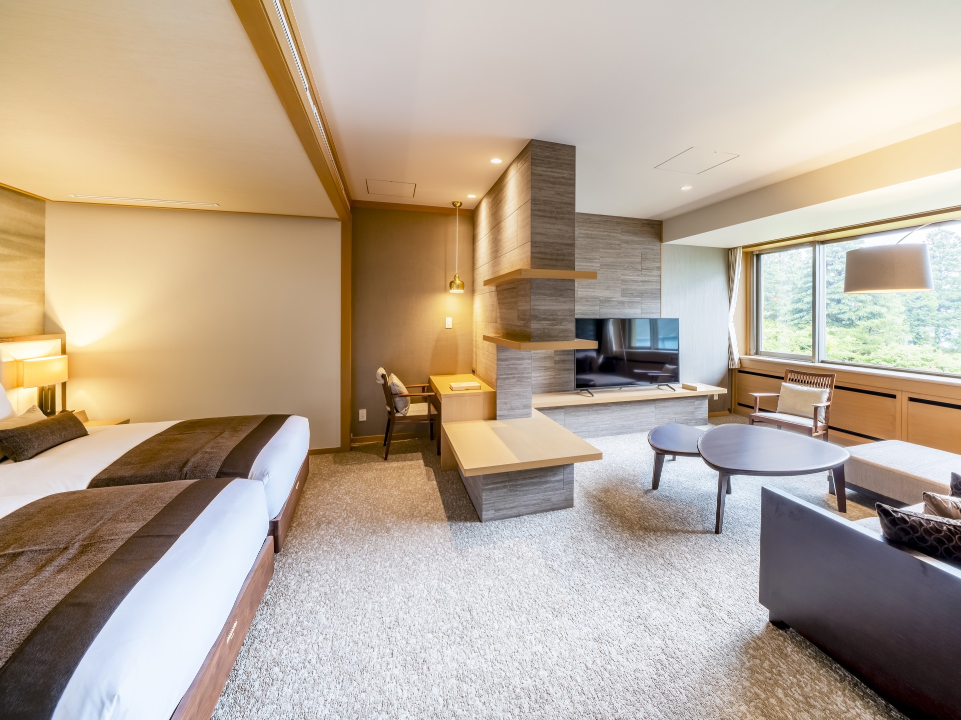 a room with two beds and a television