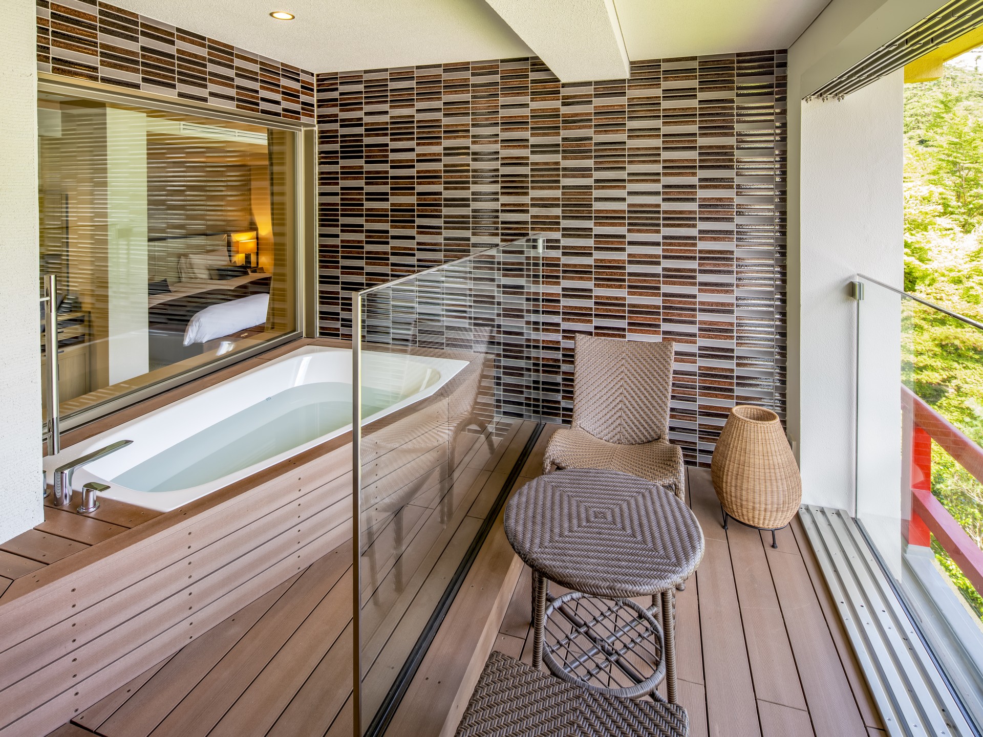 a bathroom with a tub and a glass door