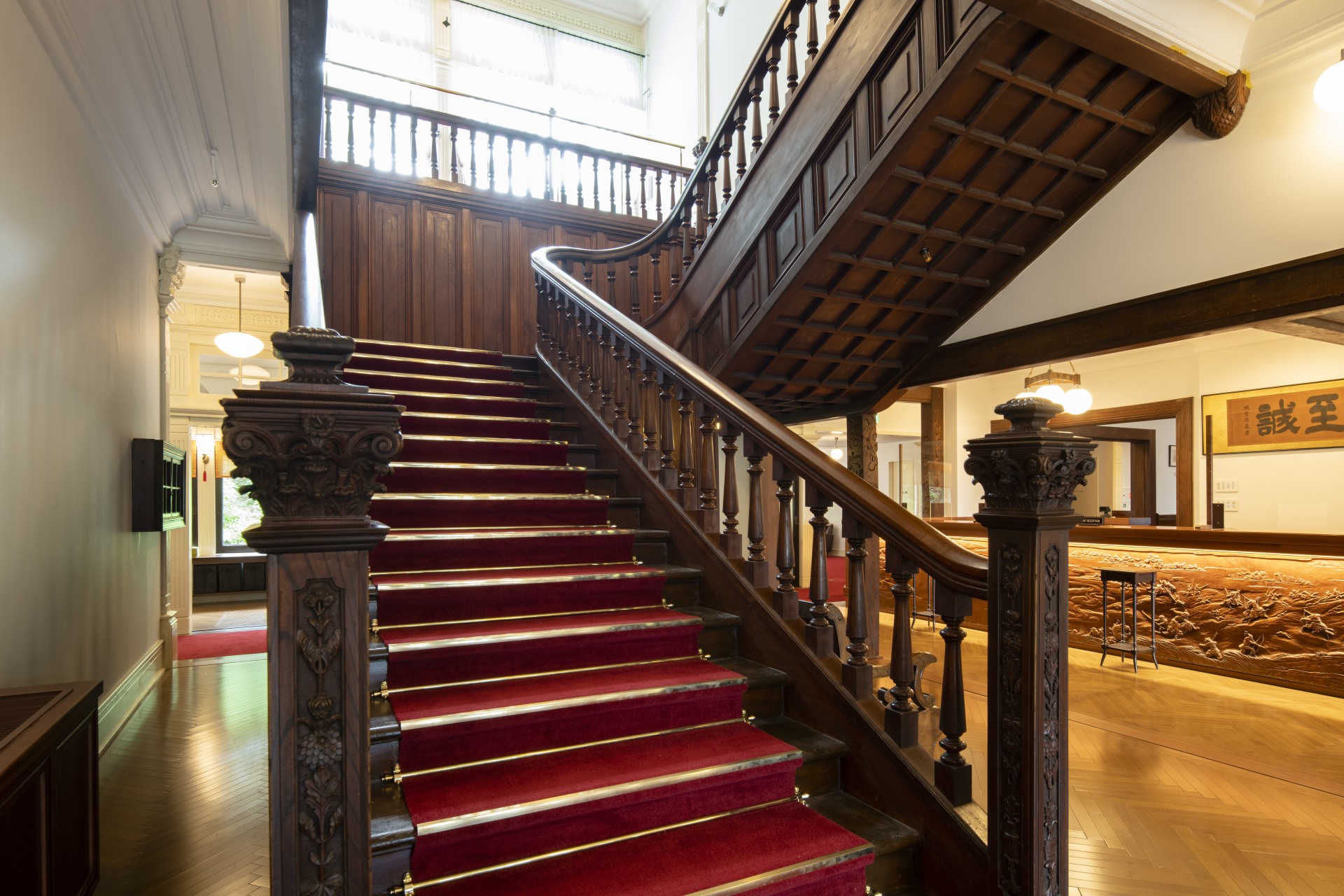 a staircase with red carpet