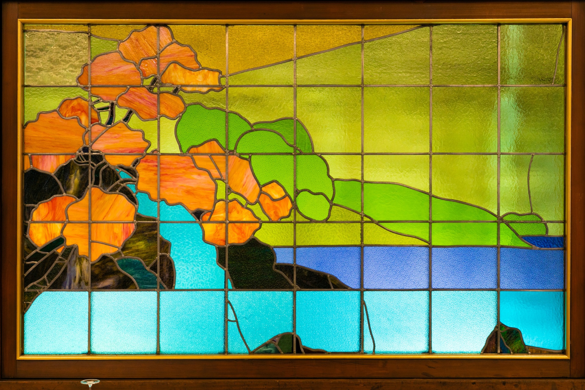 a stained glass window with colorful flowers