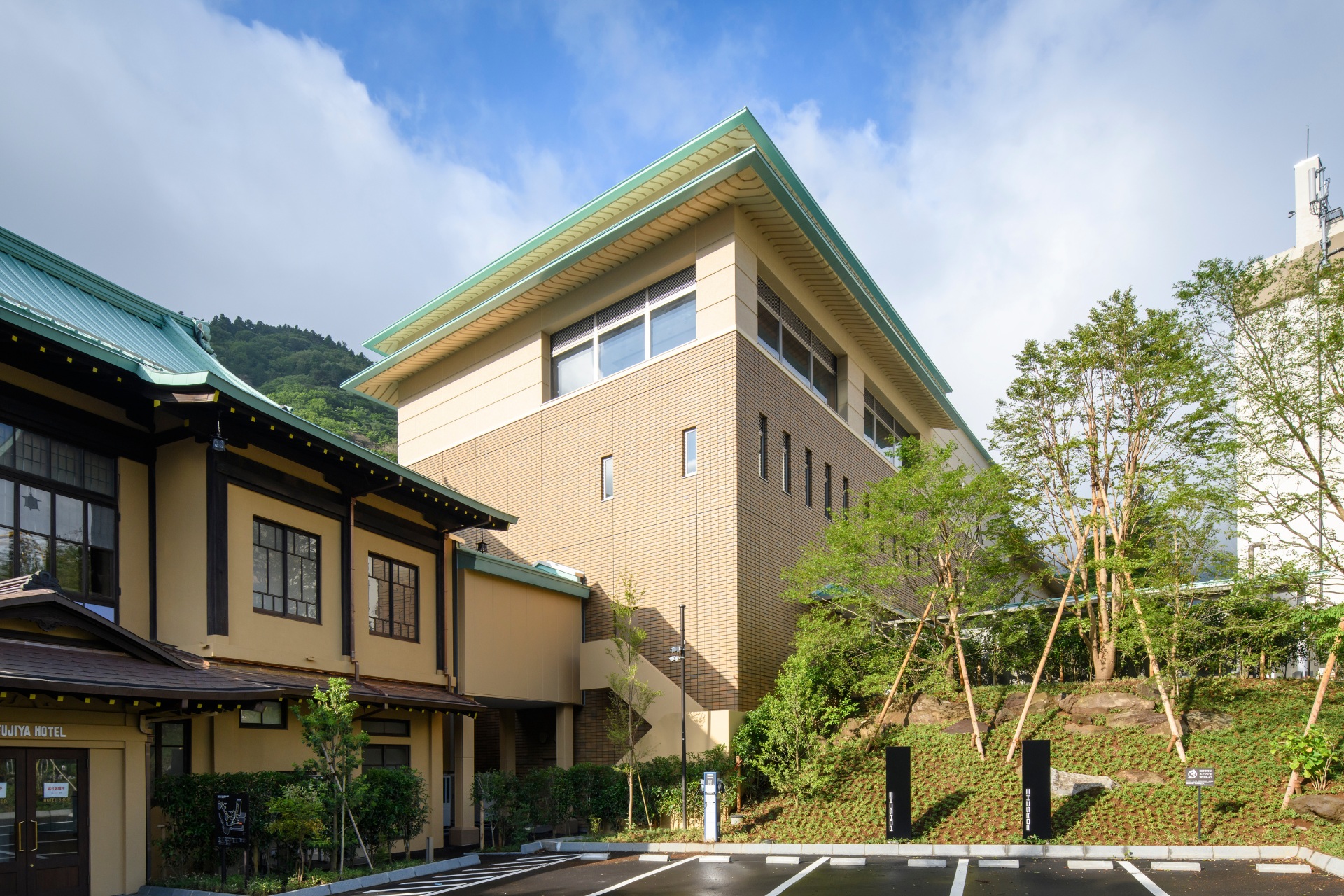 a building with trees and grass