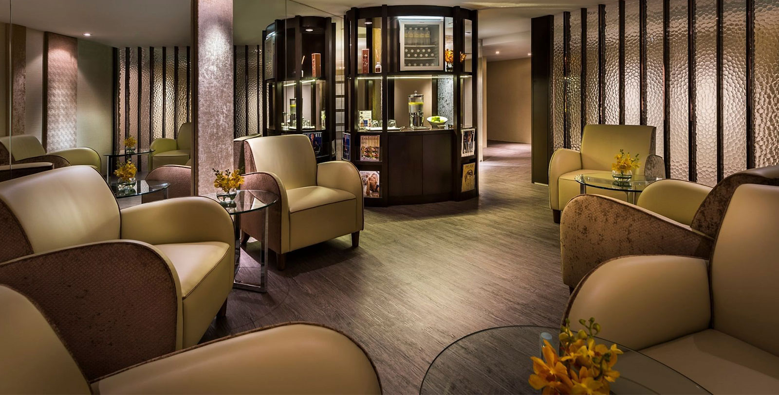 a room with chairs and a display case