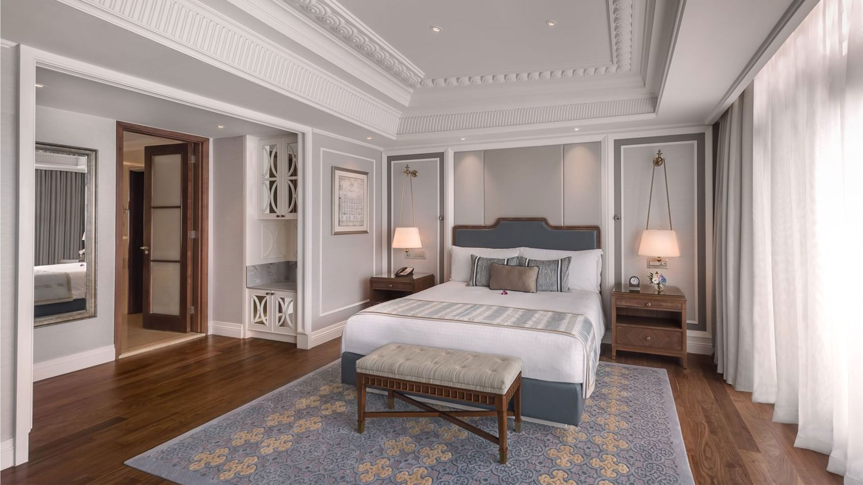 a bedroom with a bed and a rug