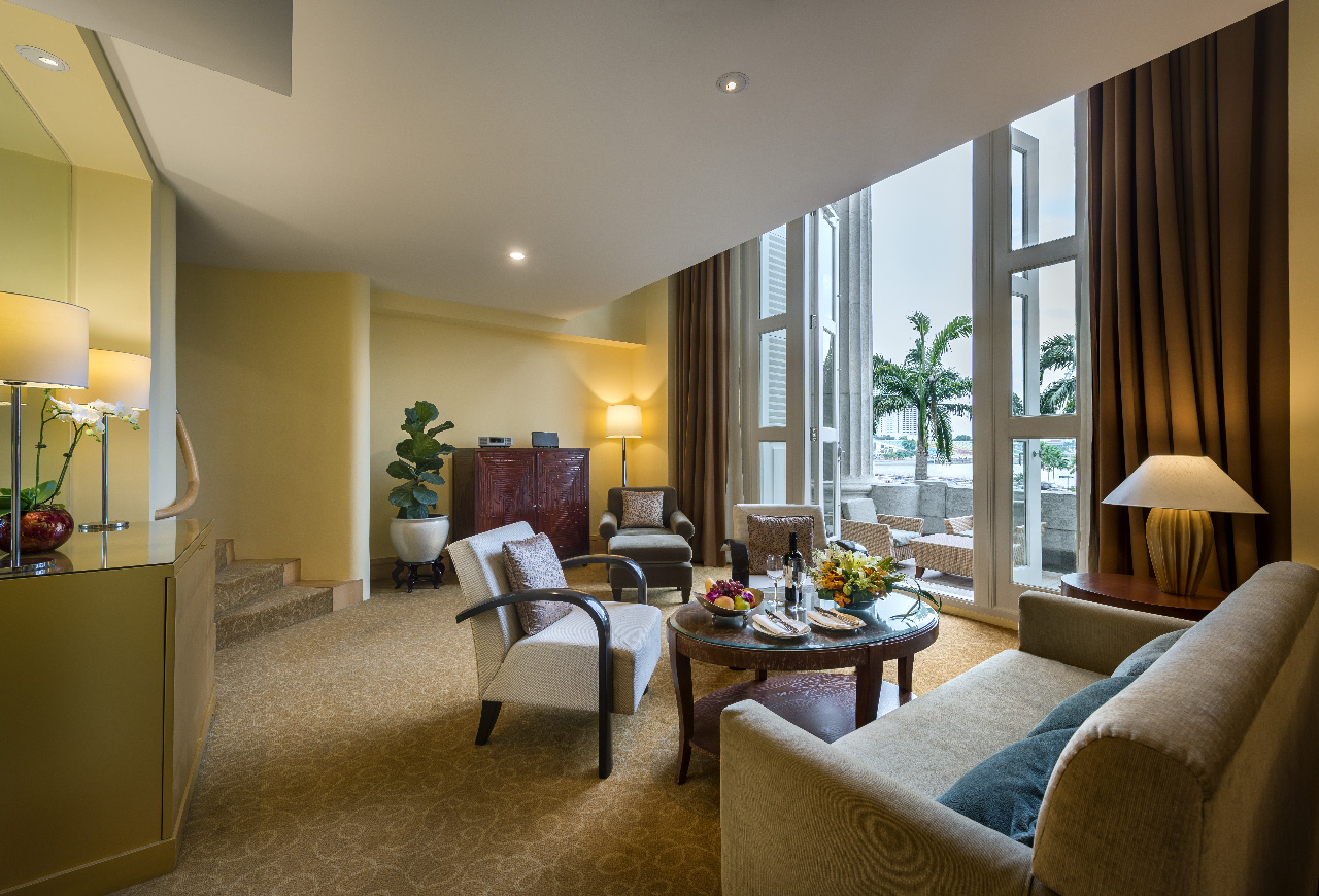 a room with a couch and chairs