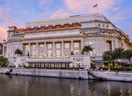 The Fullerton Hotel Singapore with a flag on it