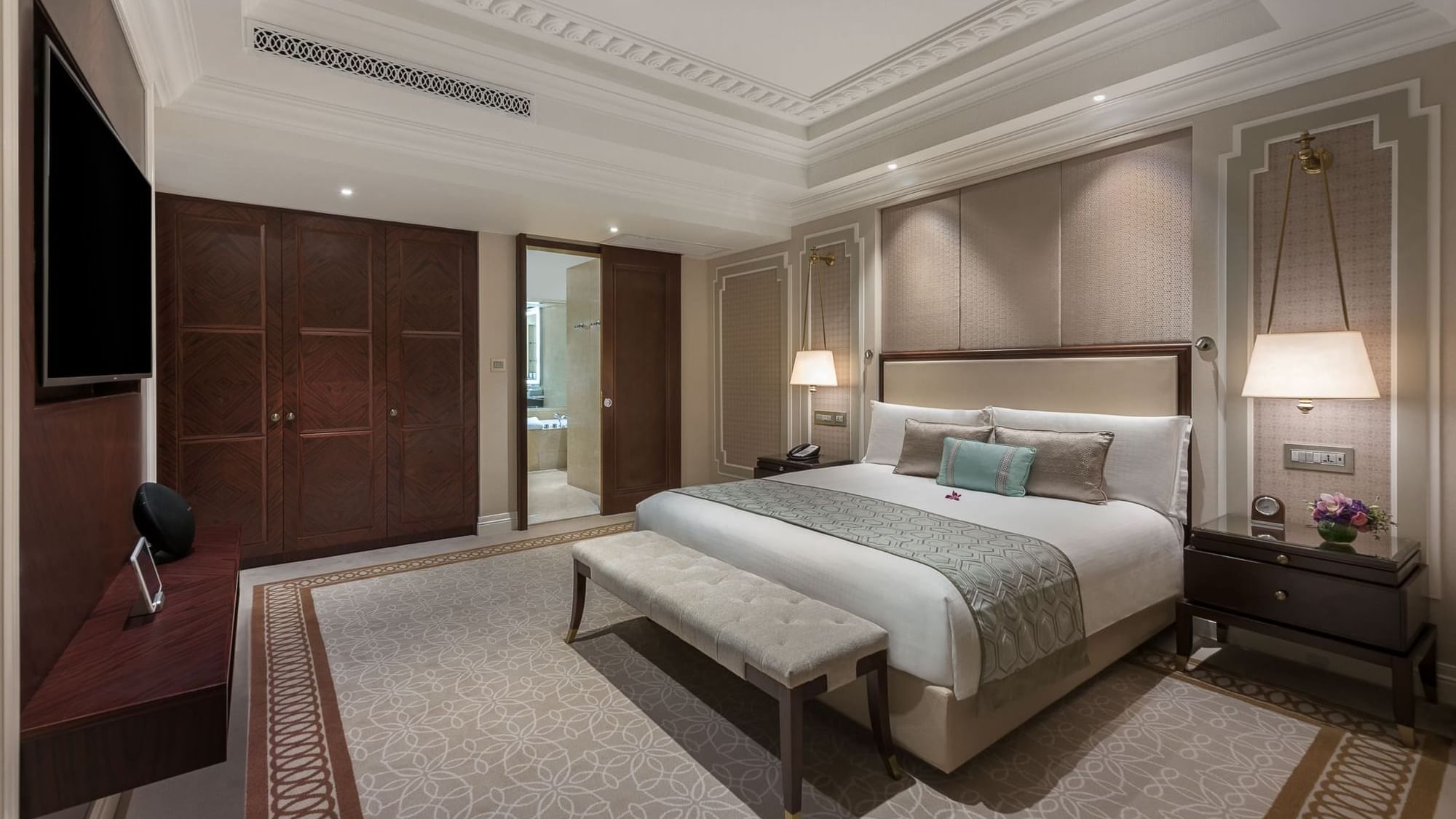 a bedroom with a bed and a bench