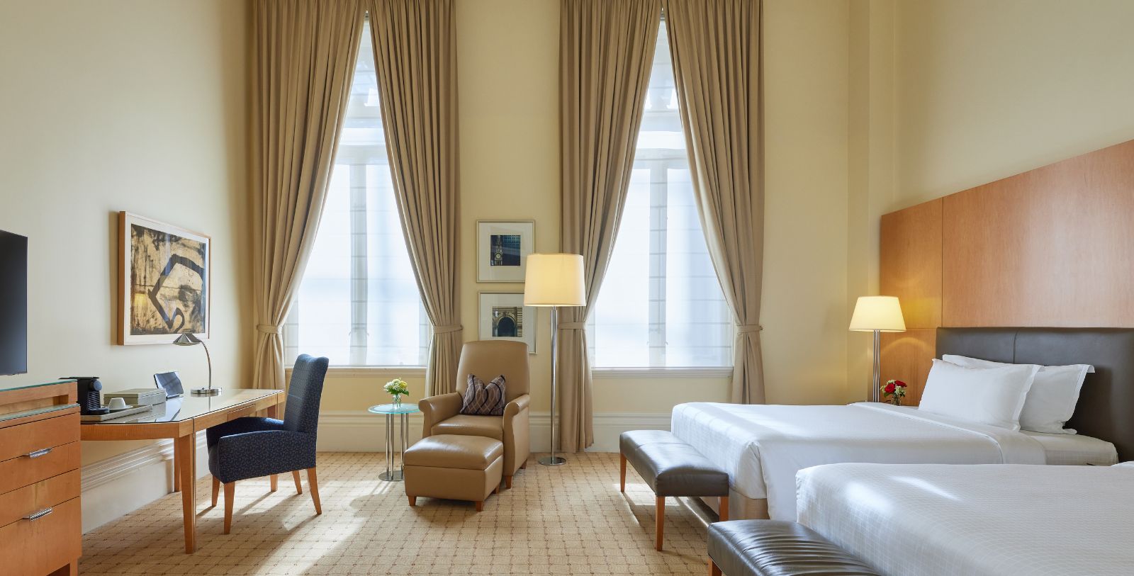 a room with two beds and a couch