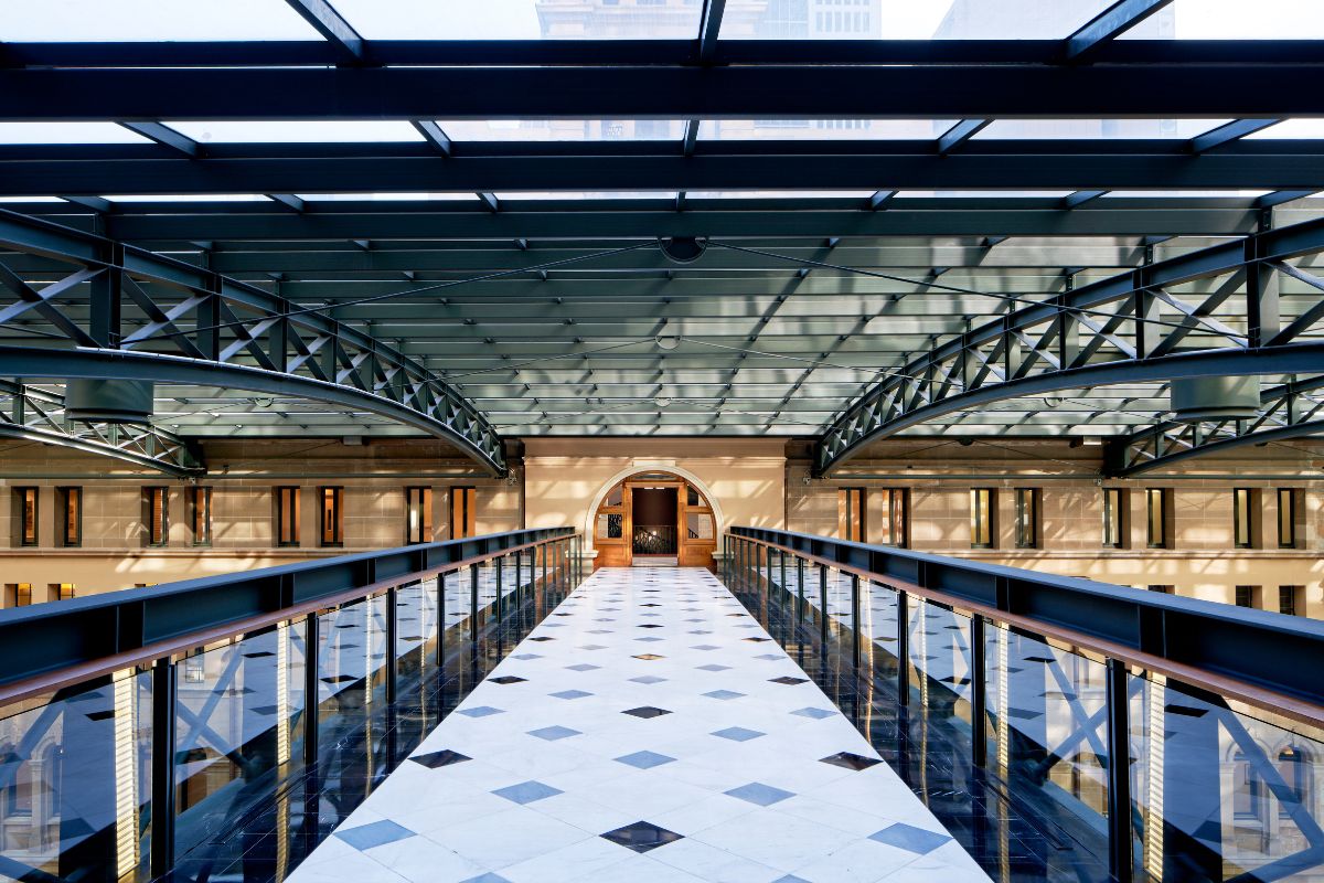 a glass walkway with a glass roof