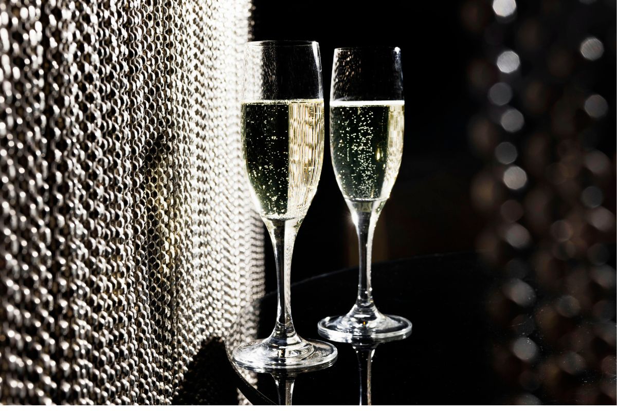 two glasses of champagne on a table