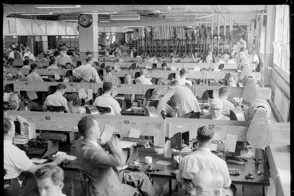 a group of people working at computers