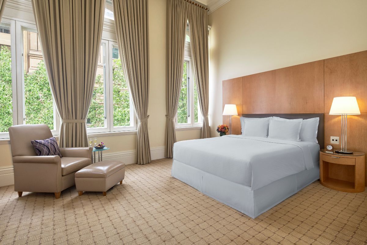 a room with a bed and a chair