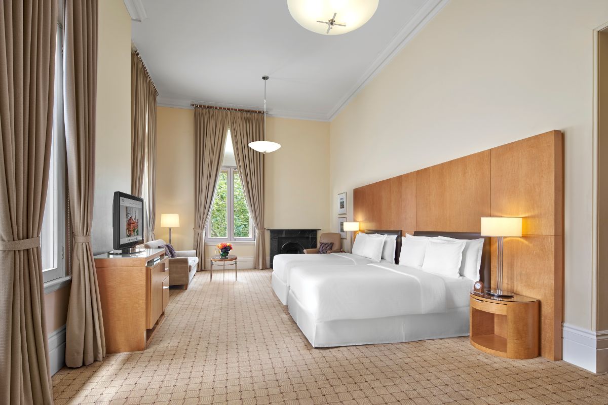 a room with a bed and a television