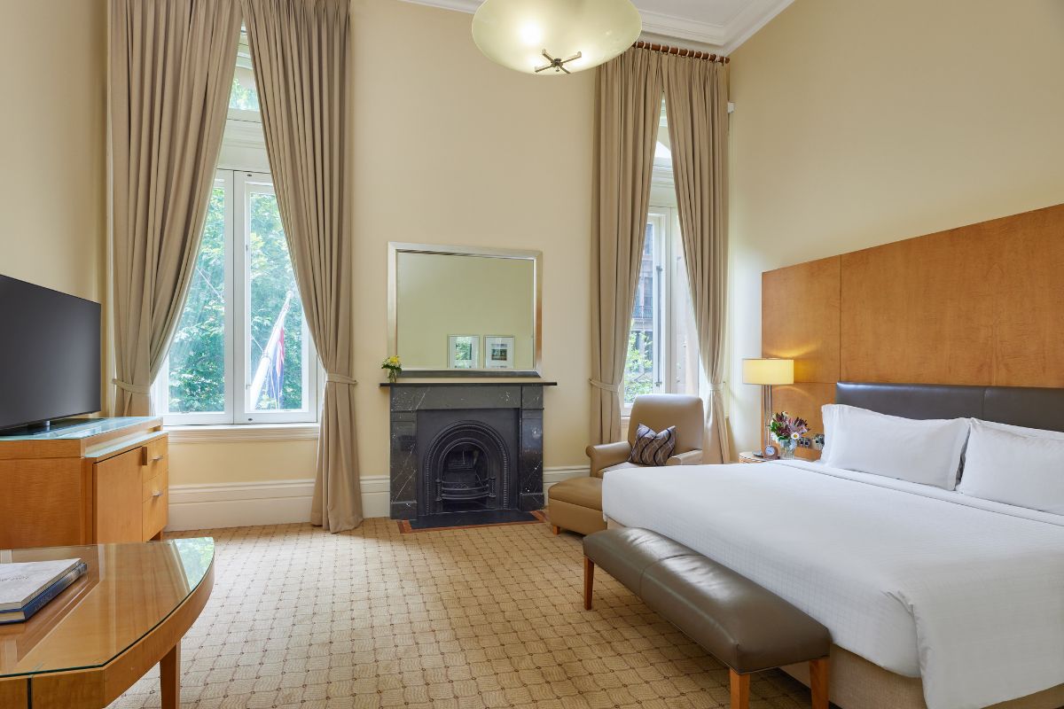 a room with a bed and a fireplace