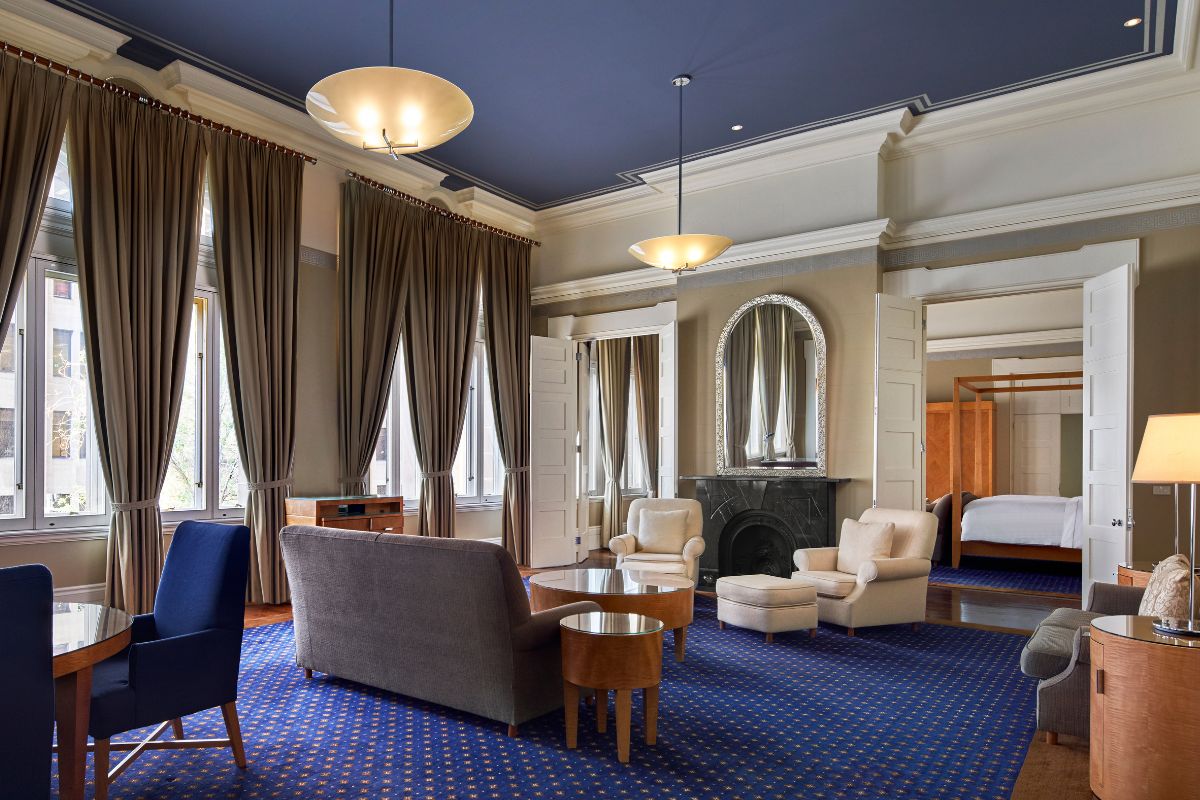 a room with a fireplace and couches