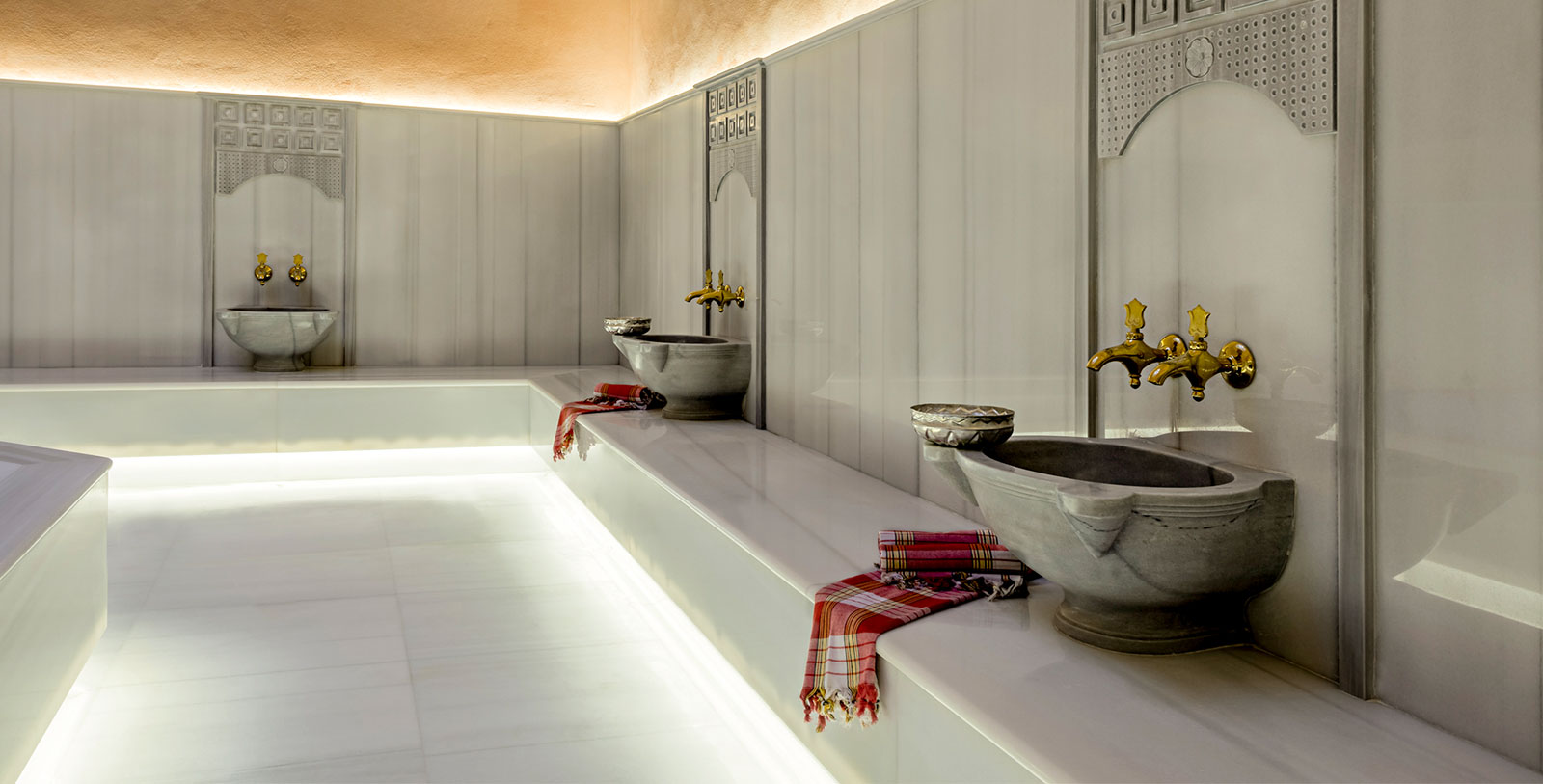 a bathroom with a sink and towels