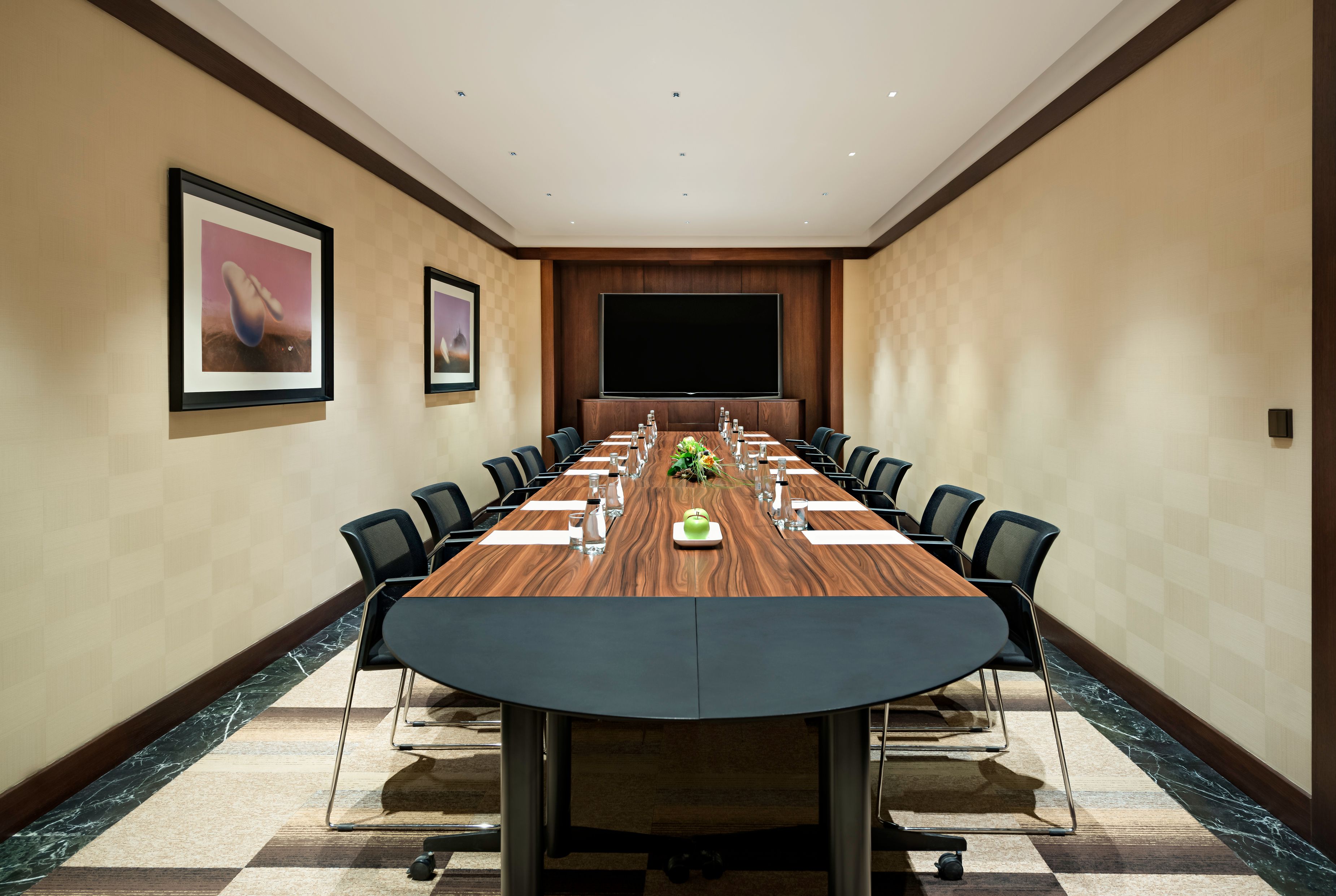 a conference room with a table and chairs