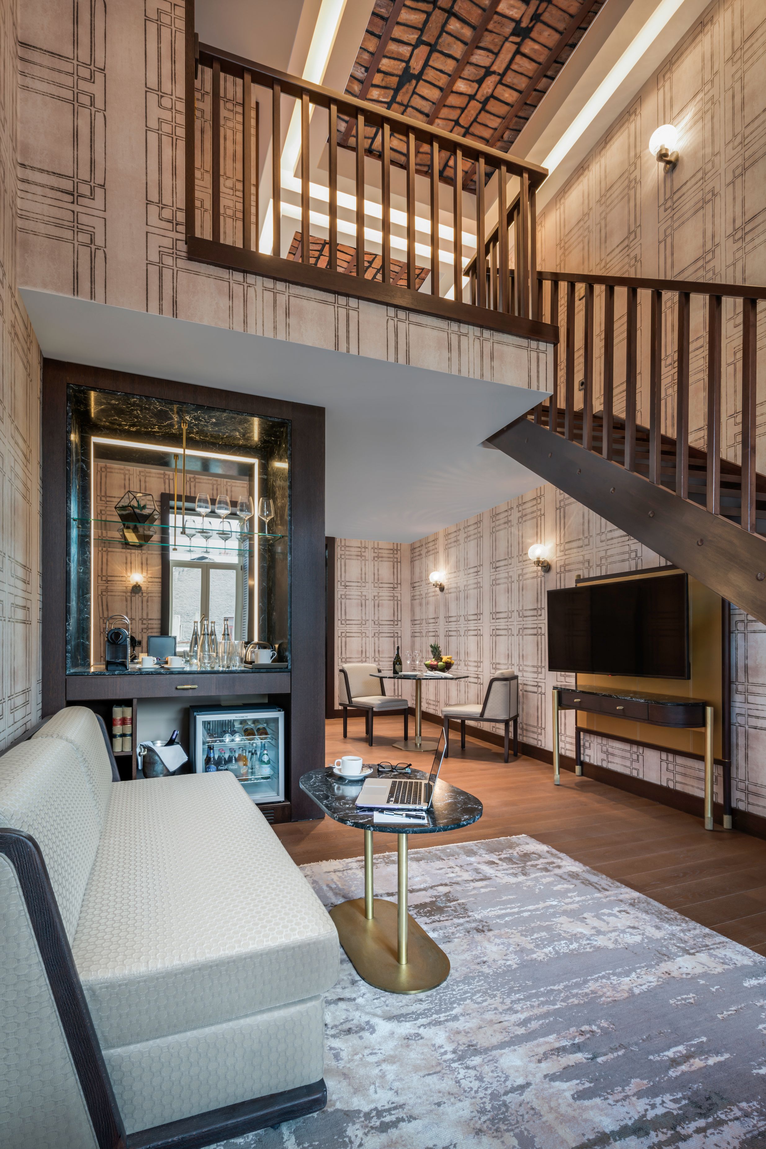 a room with a staircase and a couch