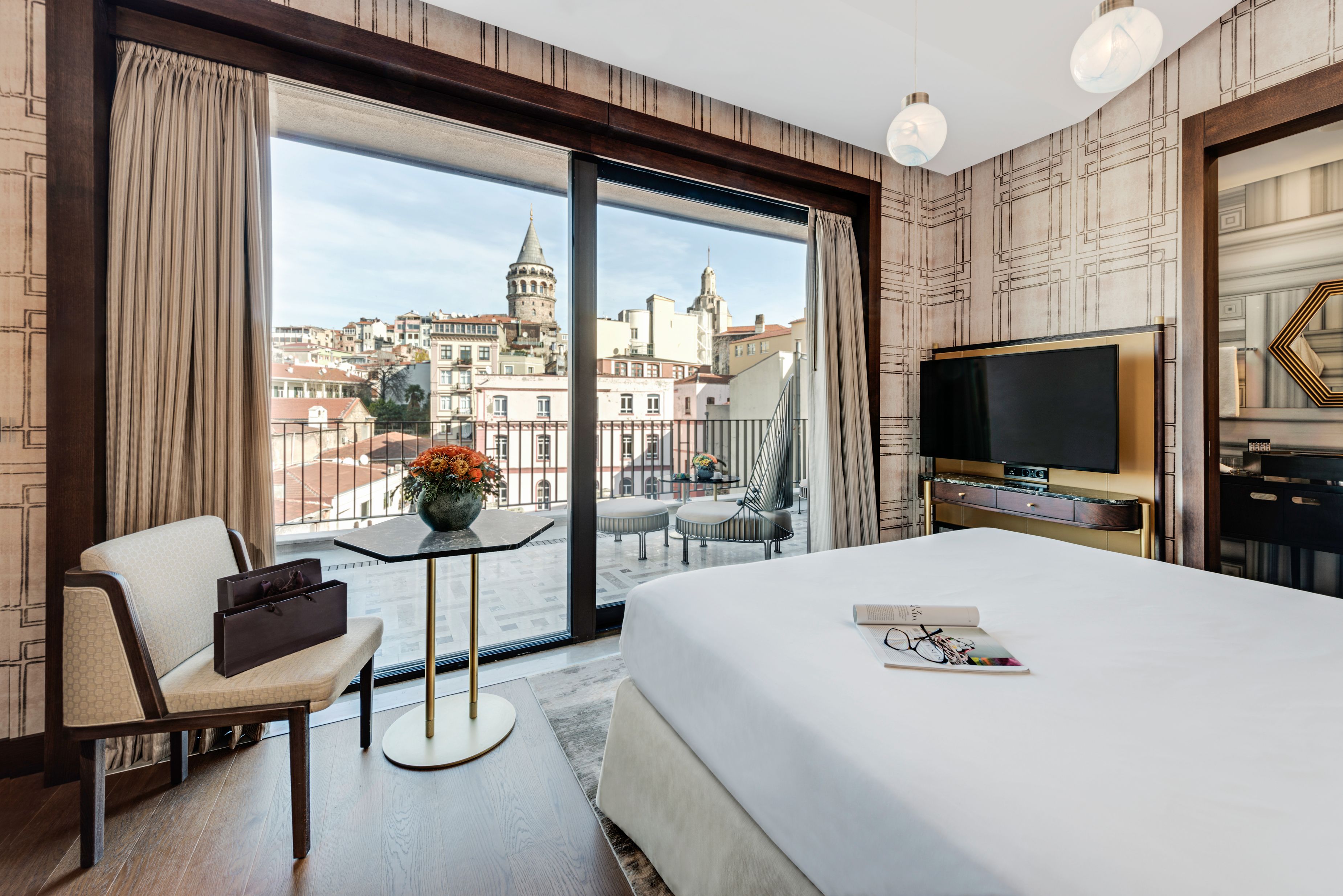 a room with a bed and a television