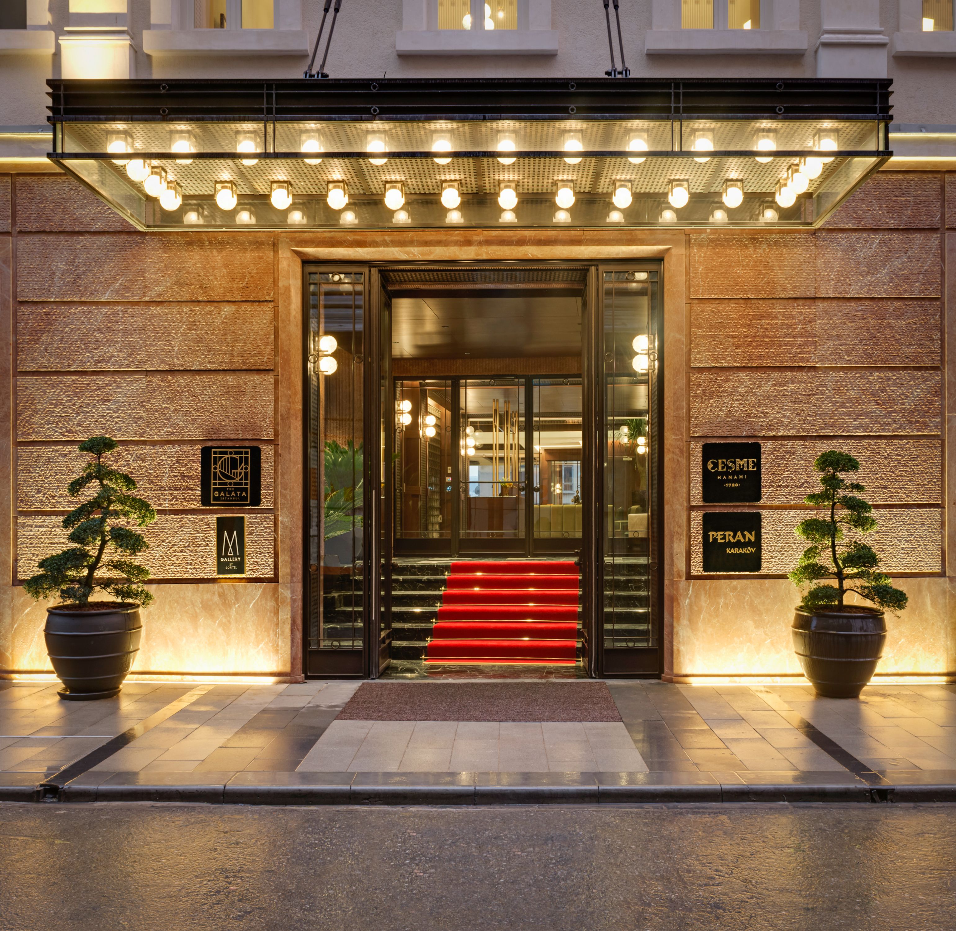 a building with a red carpet and stairs