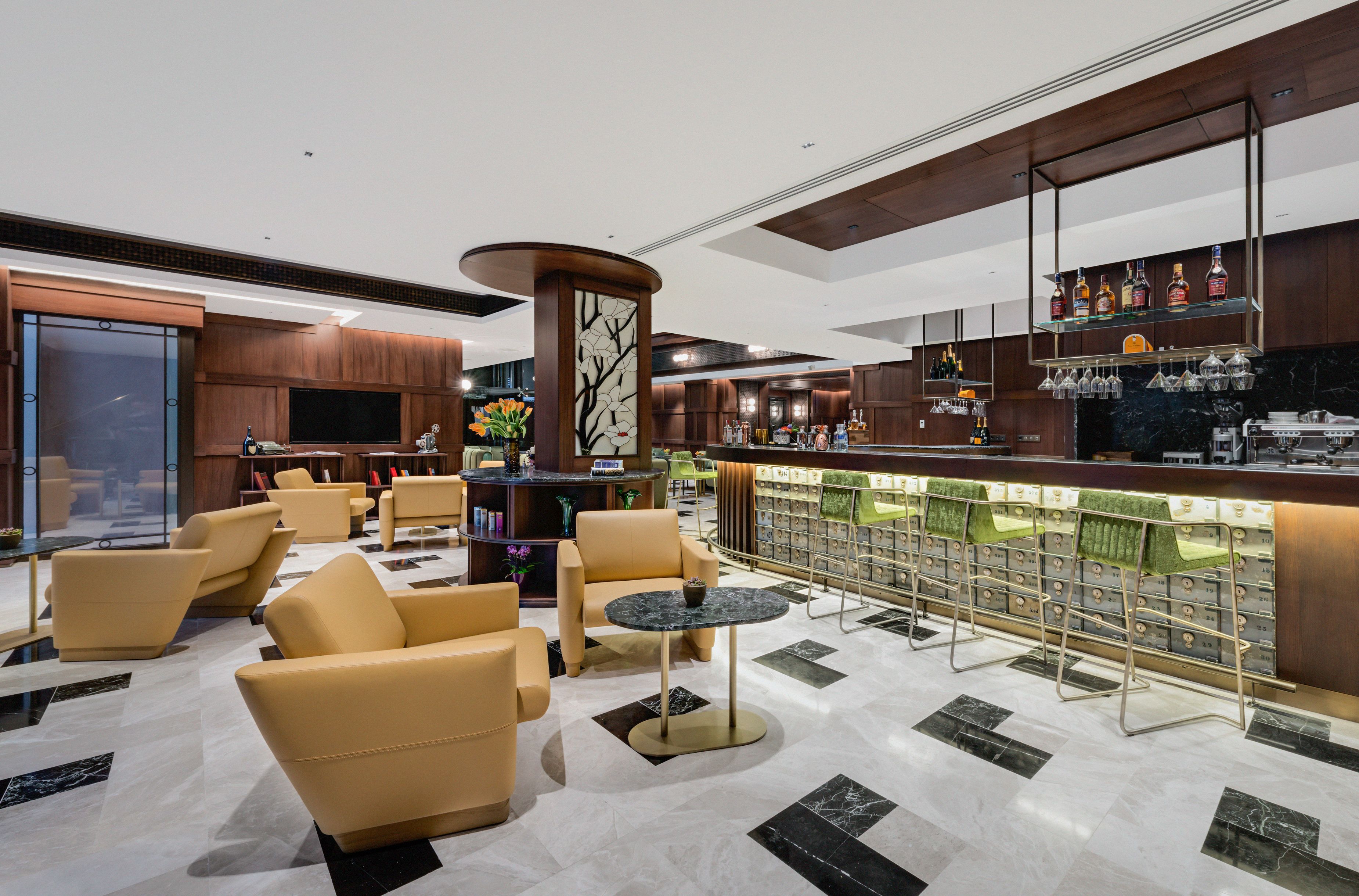 a room with chairs and a bar