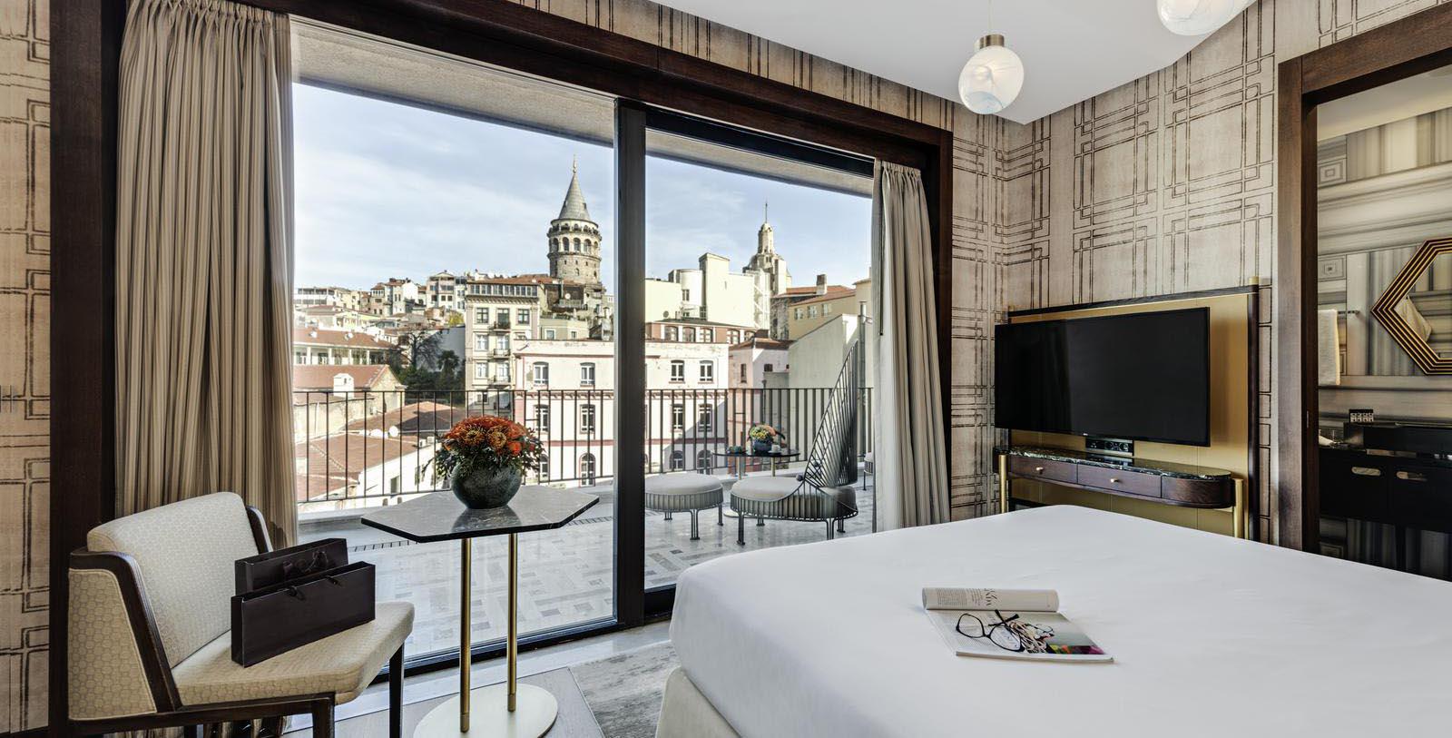 a room with a large window and a bed