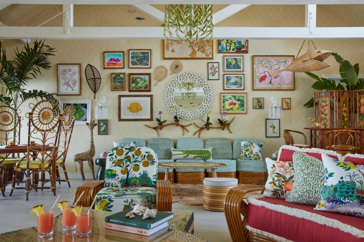 a room with a couch and chairs
