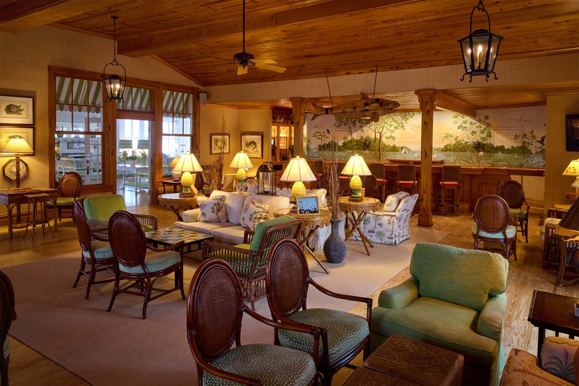 a room with a couch and chairs