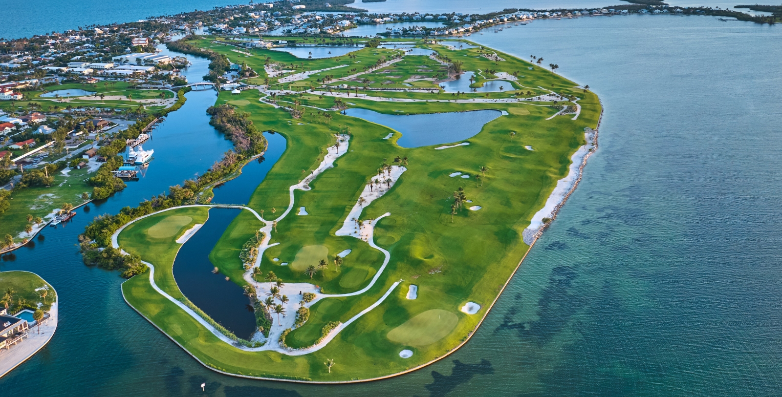 an island with a golf course and water