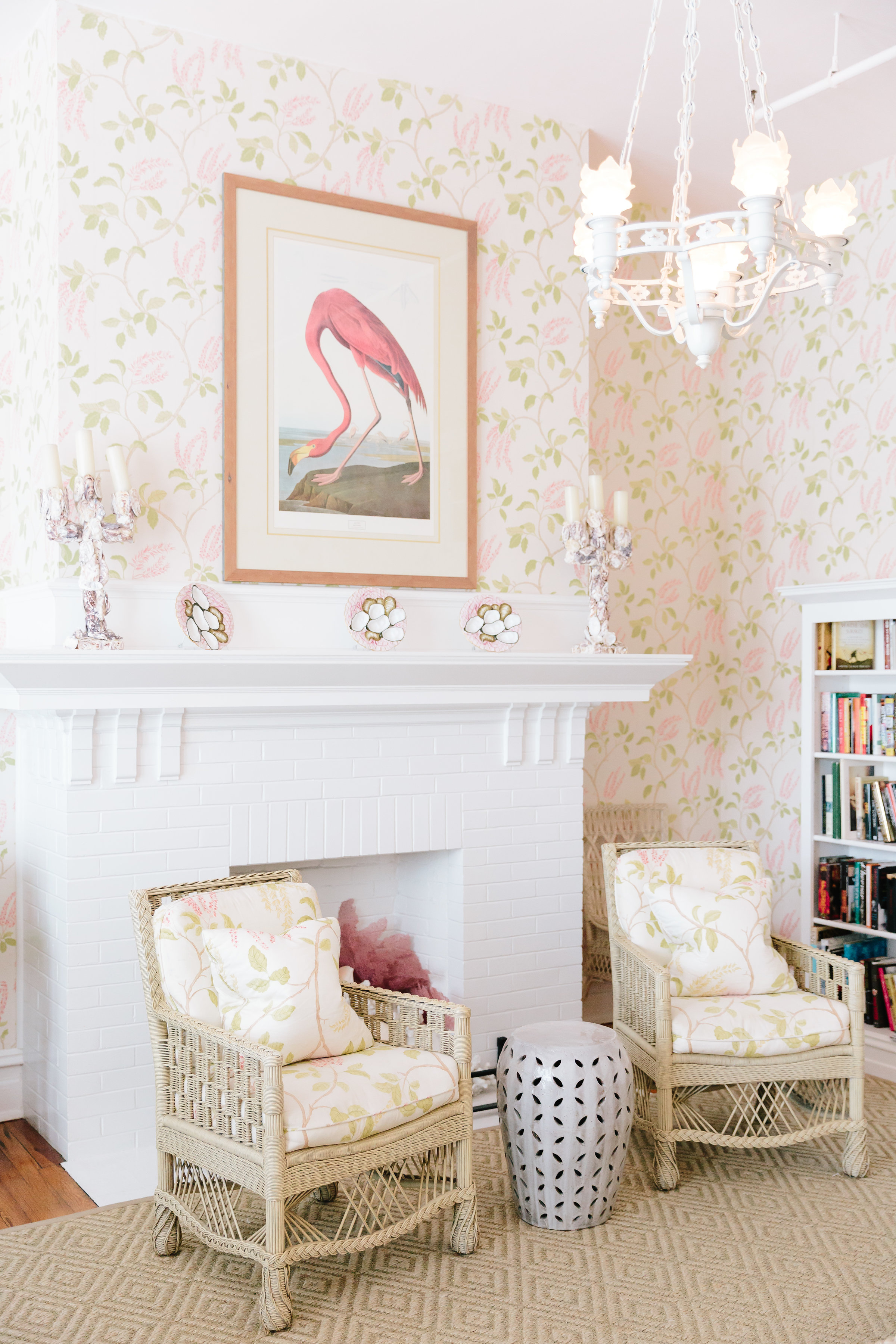 a room with a fireplace and chairs