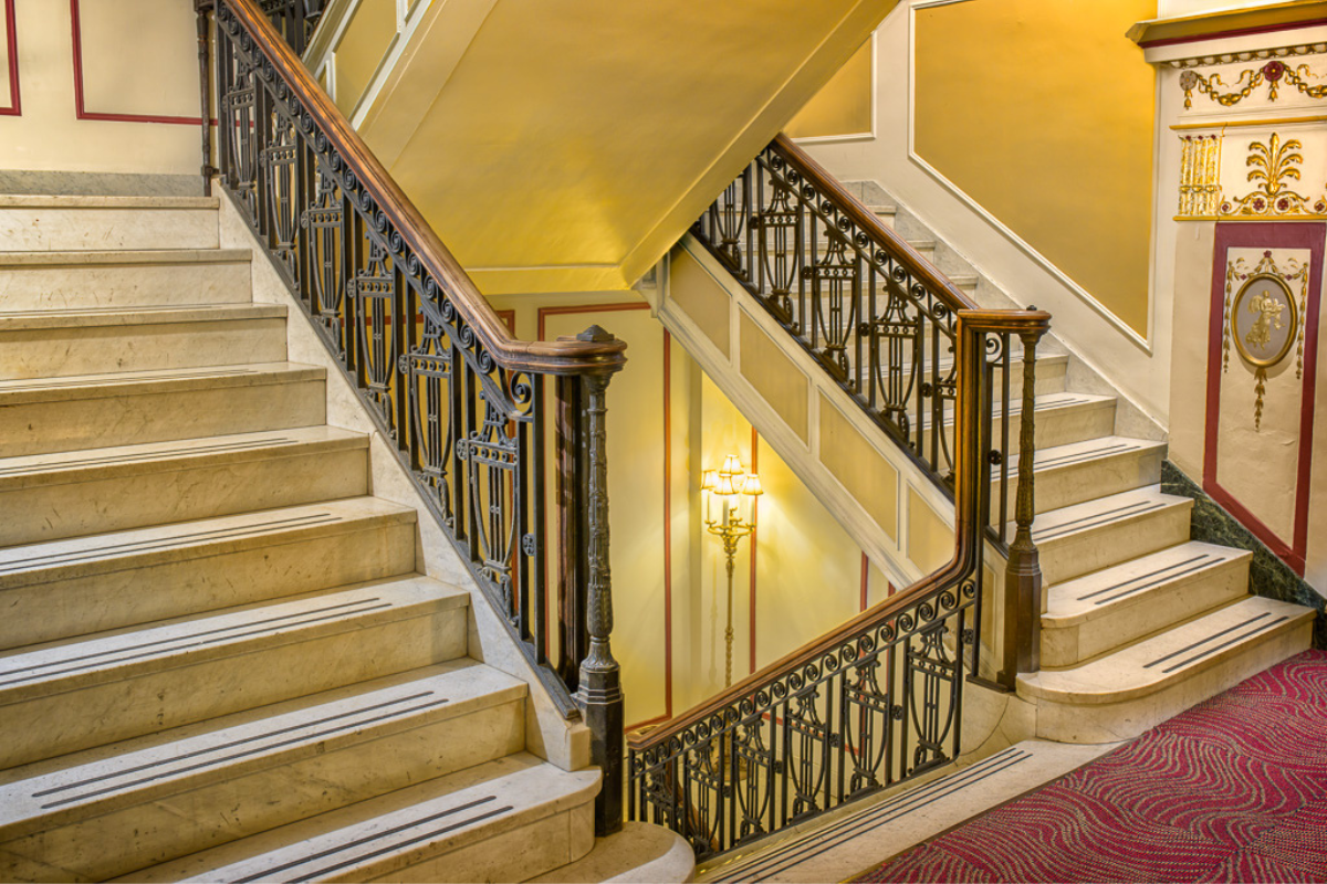 a staircase with a metal railing