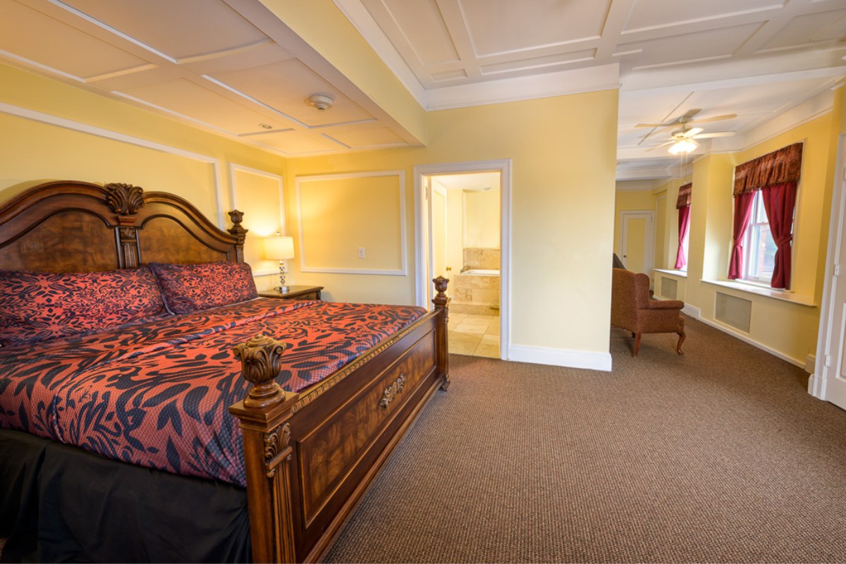 a bedroom with a bed and a chair