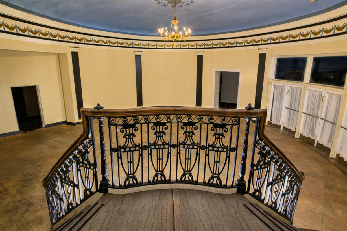 a staircase with a chandelier