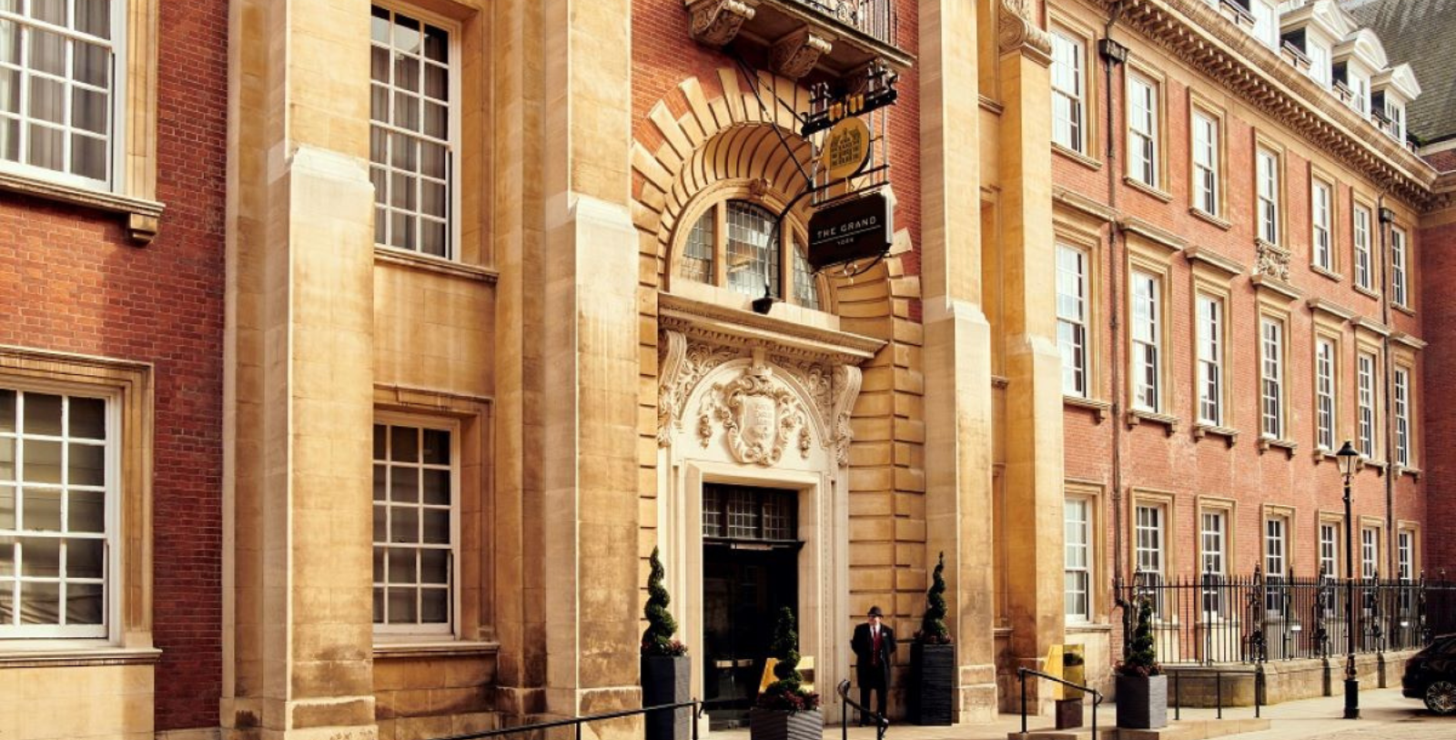 a man standing outside of a building