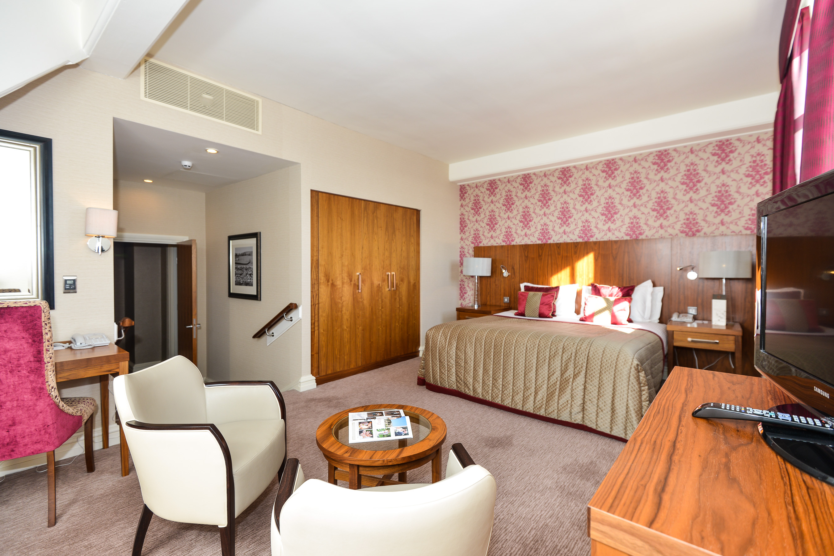a bedroom with a bed and a table