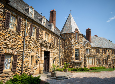 a large stone building with a pointed roof