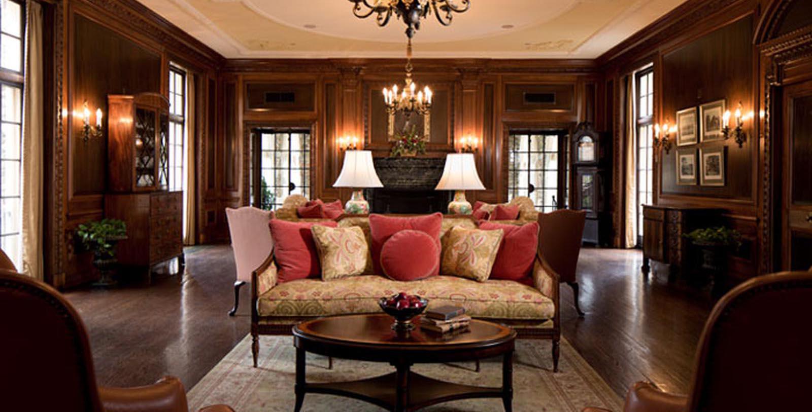 a living room with a chandelier and couch