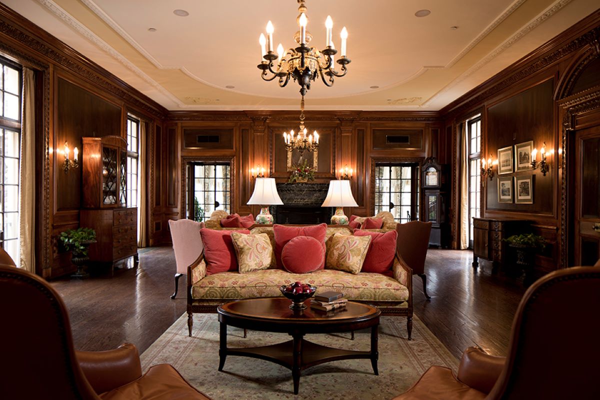 a living room with a chandelier and couch
