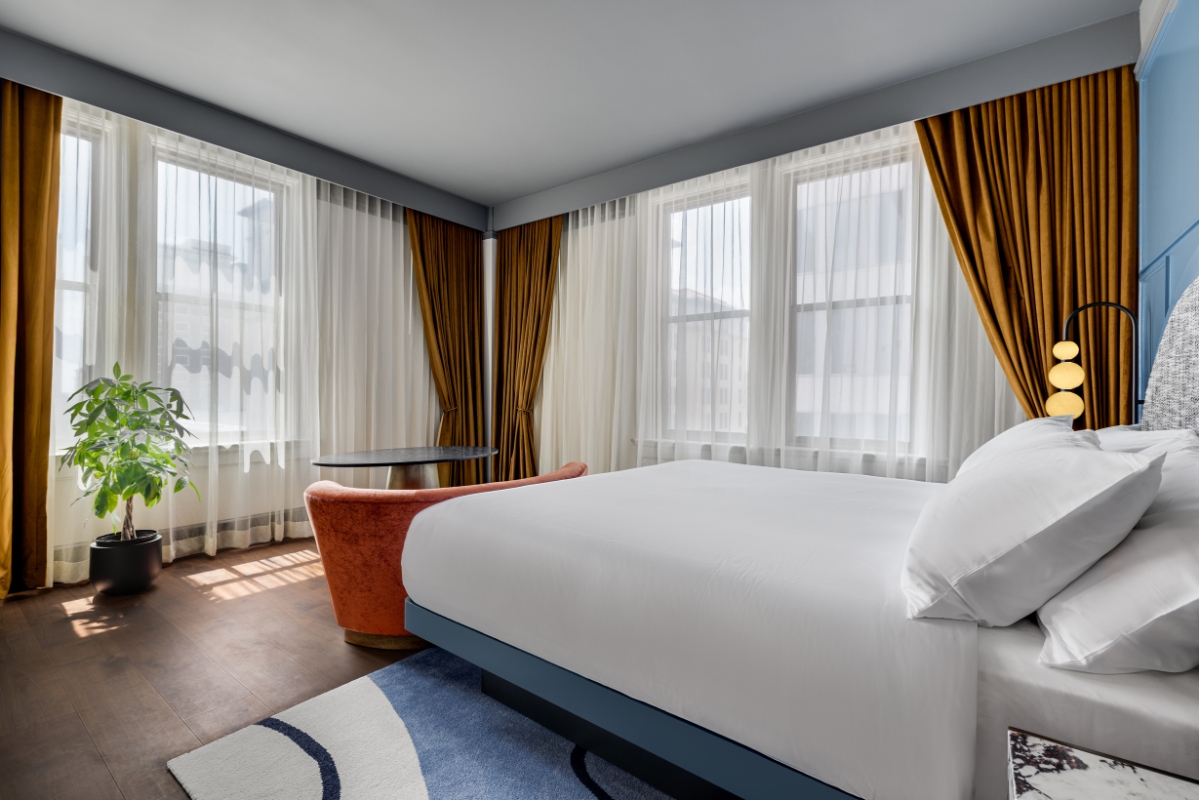 a bed in a room with curtains