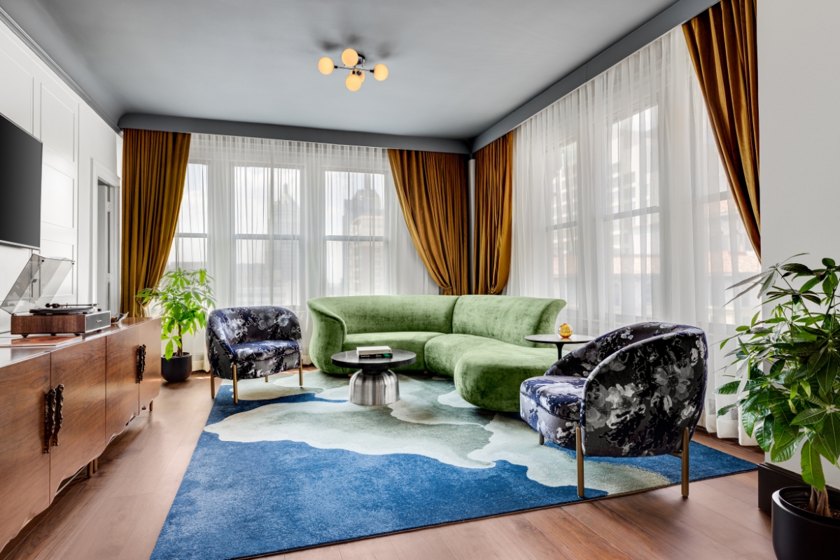 a living room with a couch and chairs
