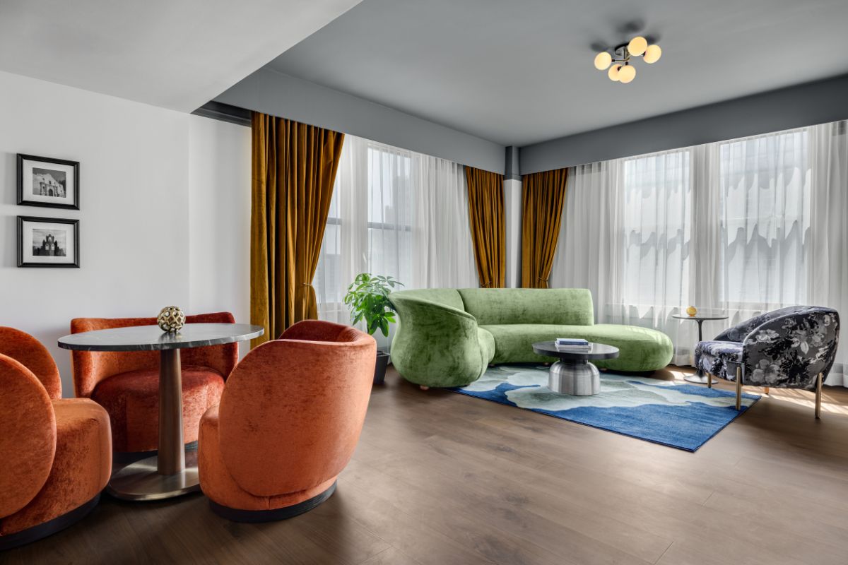 a living room with couches and tables